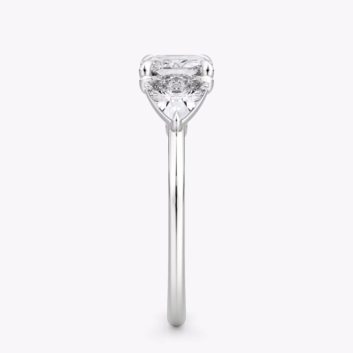 The Three Stone | Radiant | Platinum | bandAccent: Plain | diamondOrientation: horizontal | sideStoneCarat: 0.50ct | sideStoneShape: Trillion | caratWeight: other
