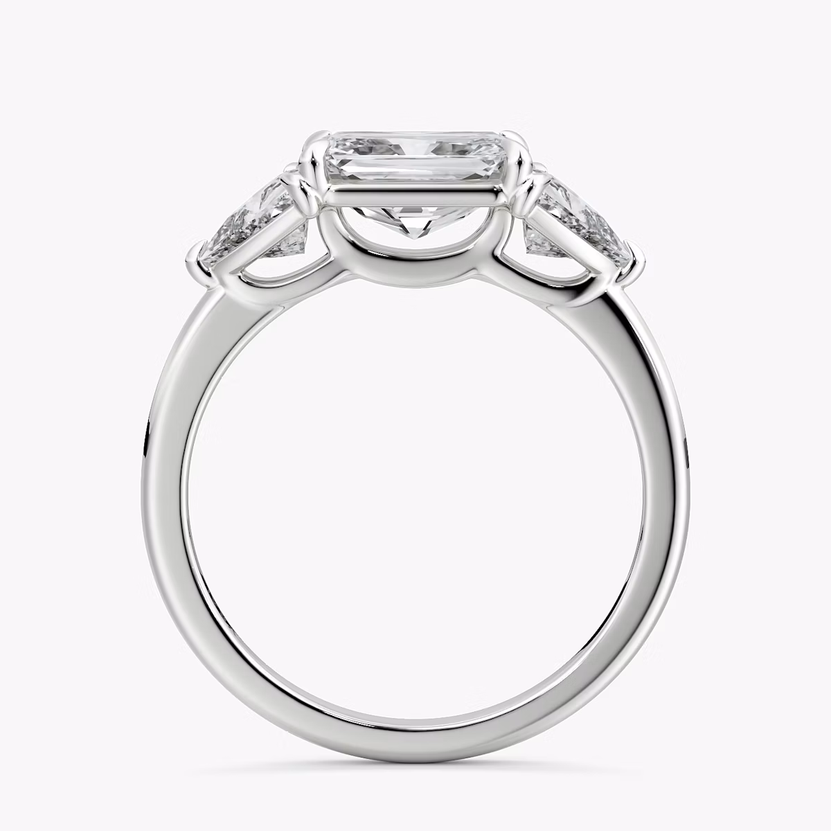 The Three Stone | Radiant | Platinum | bandAccent: Plain | diamondOrientation: horizontal | sideStoneCarat: 0.50ct | sideStoneShape: Trillion | caratWeight: other