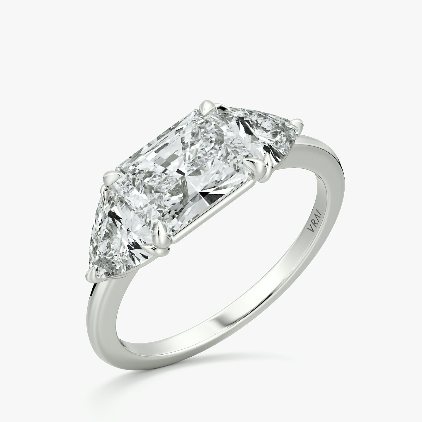 The Three Stone | Radiant | 18k | White Gold | bandAccent: Plain | diamondOrientation: horizontal | sideStoneCarat: 0.50ct | sideStoneShape: Trillion | caratWeight: other