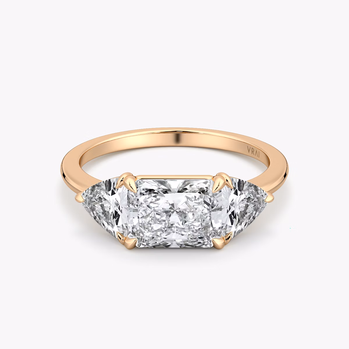 The Three Stone | Radiant | 14k | Rose Gold | bandAccent: Plain | diamondOrientation: horizontal | sideStoneCarat: 0.50ct | sideStoneShape: Trillion | caratWeight: other