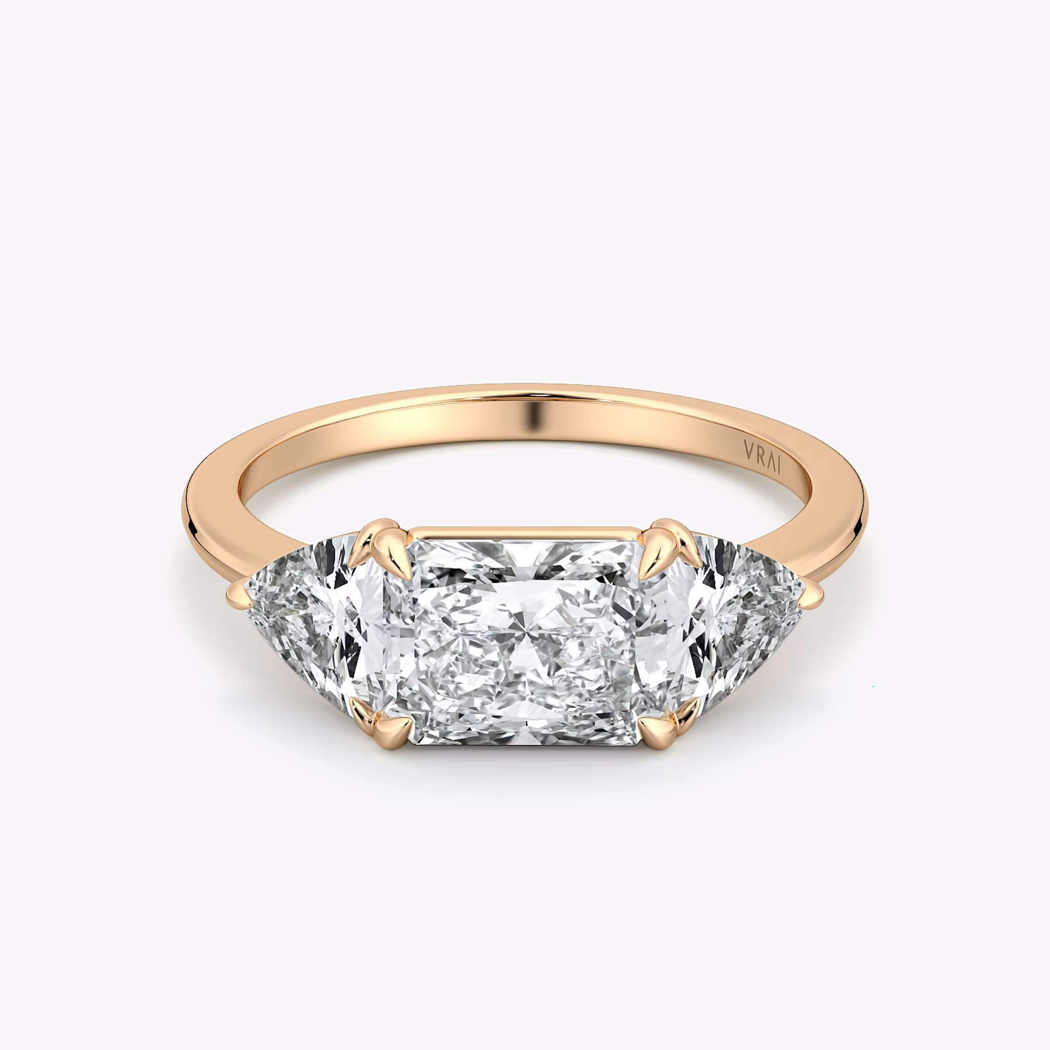 The Three Stone | Radiant | 14k | Rose Gold | bandAccent: Plain | diamondOrientation: horizontal | sideStoneCarat: 0.50ct | sideStoneShape: Trillion | caratWeight: other
