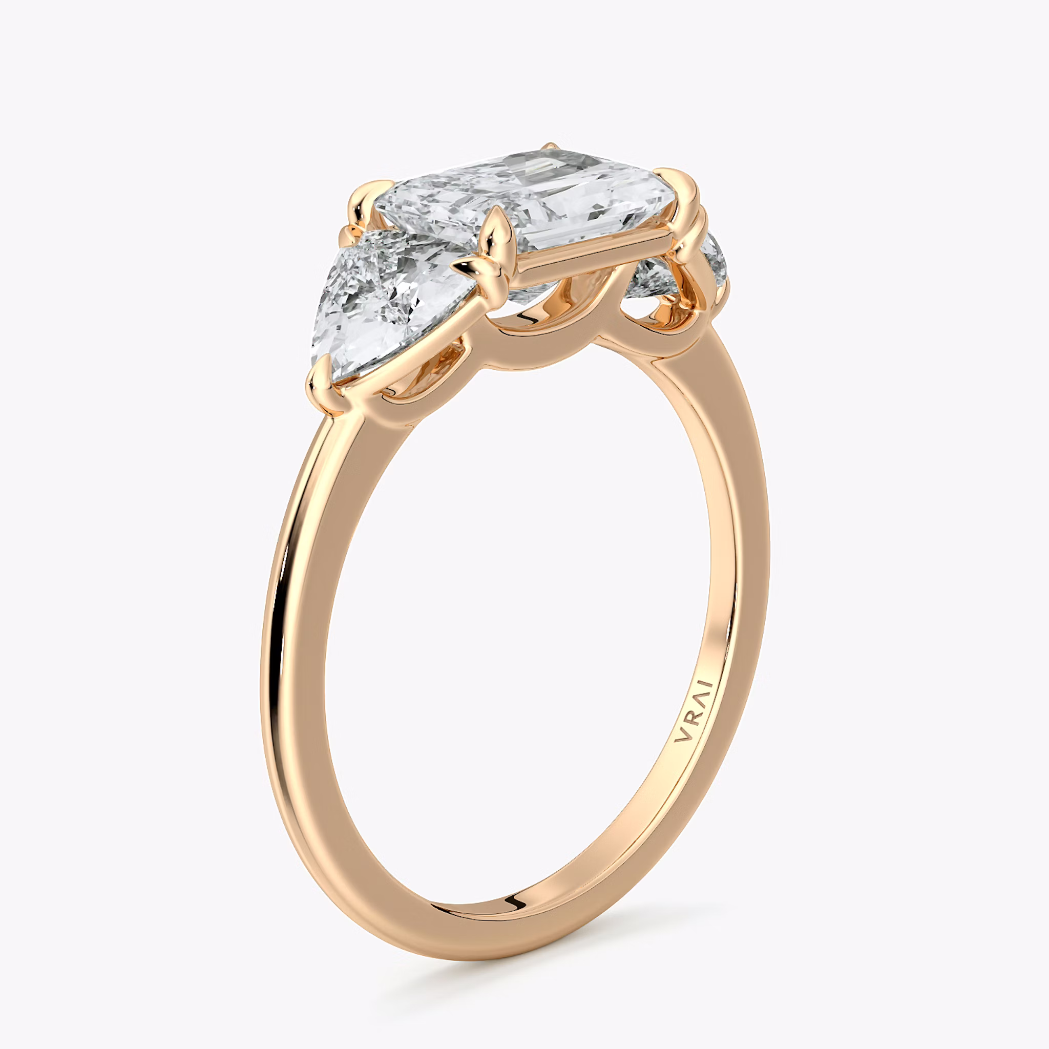 The Three Stone | Radiant | 14k | Rose Gold | bandAccent: Plain | diamondOrientation: horizontal | sideStoneCarat: 0.50ct | sideStoneShape: Trillion | caratWeight: other