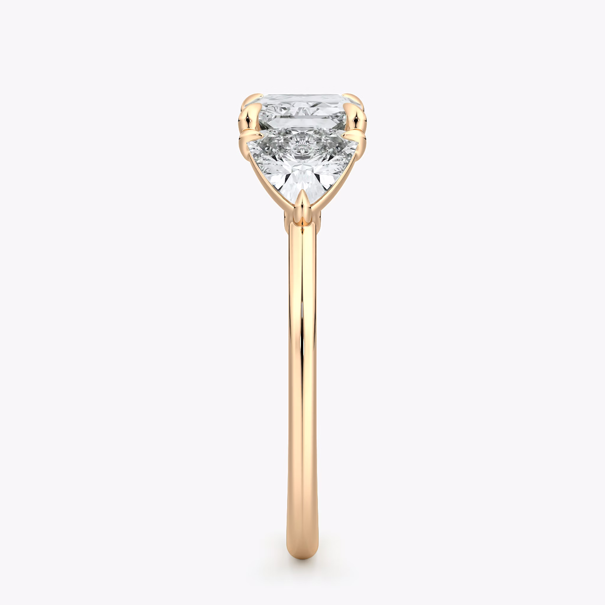 The Three Stone | Radiant | 14k | Rose Gold | bandAccent: Plain | diamondOrientation: horizontal | sideStoneCarat: 0.50ct | sideStoneShape: Trillion | caratWeight: other