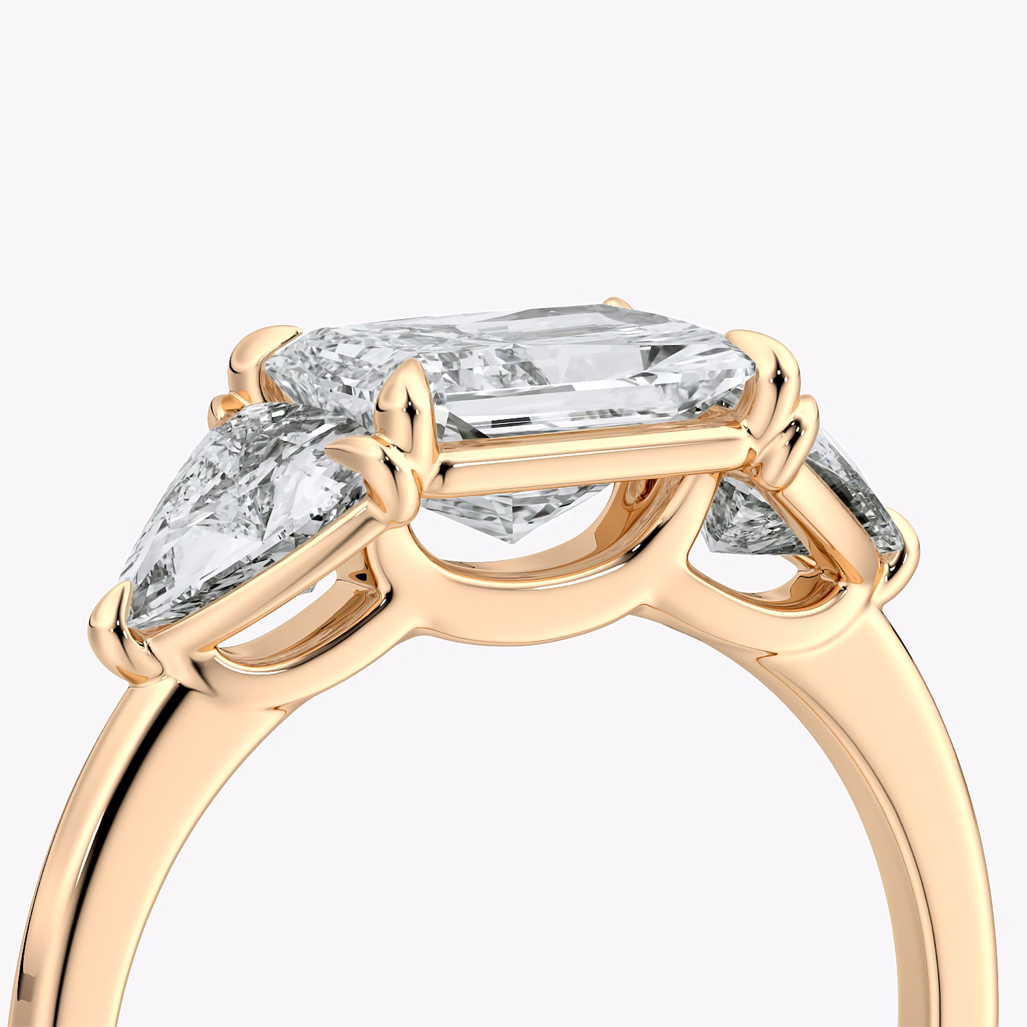 The Three Stone | Radiant | 14k | Rose Gold | bandAccent: Plain | diamondOrientation: horizontal | sideStoneCarat: 0.50ct | sideStoneShape: Trillion | caratWeight: other