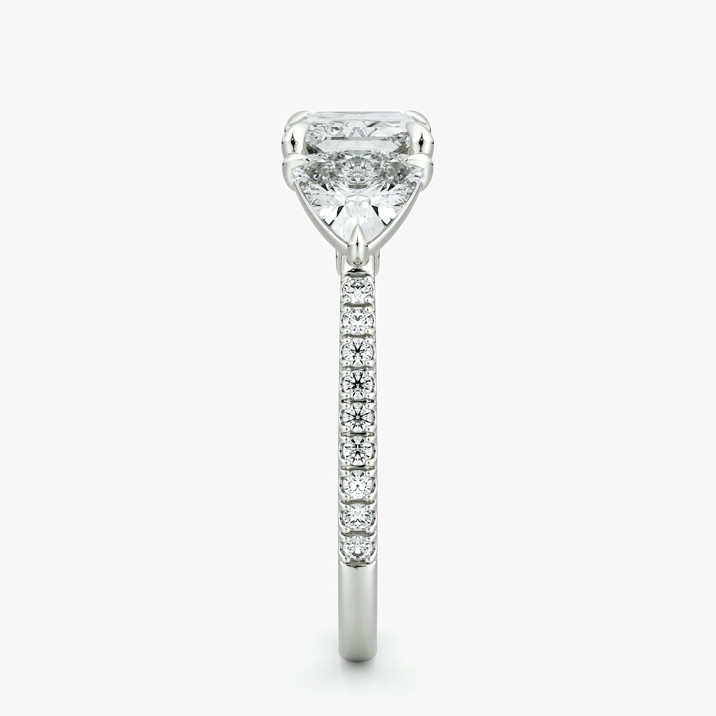 The Three Stone | Radiant | Platinum | bandAccent: Pavé | diamondOrientation: horizontal | sideStoneCarat: 0.50ct | sideStoneShape: Trillion | caratWeight: other