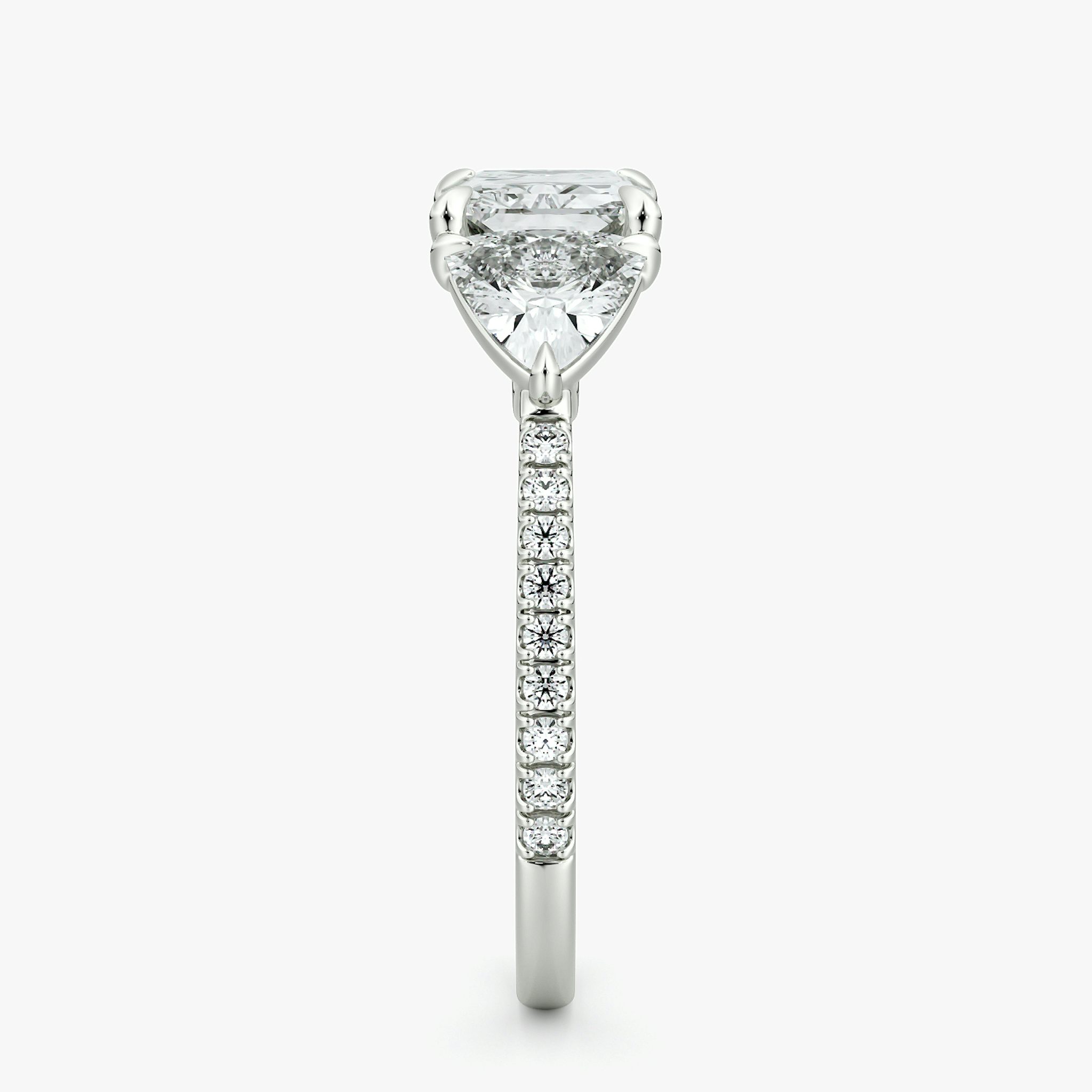 The Three Stone | Radiant | 18k | White Gold | bandAccent: Pavé | diamondOrientation: horizontal | sideStoneCarat: 0.50ct | sideStoneShape: Trillion | caratWeight: other