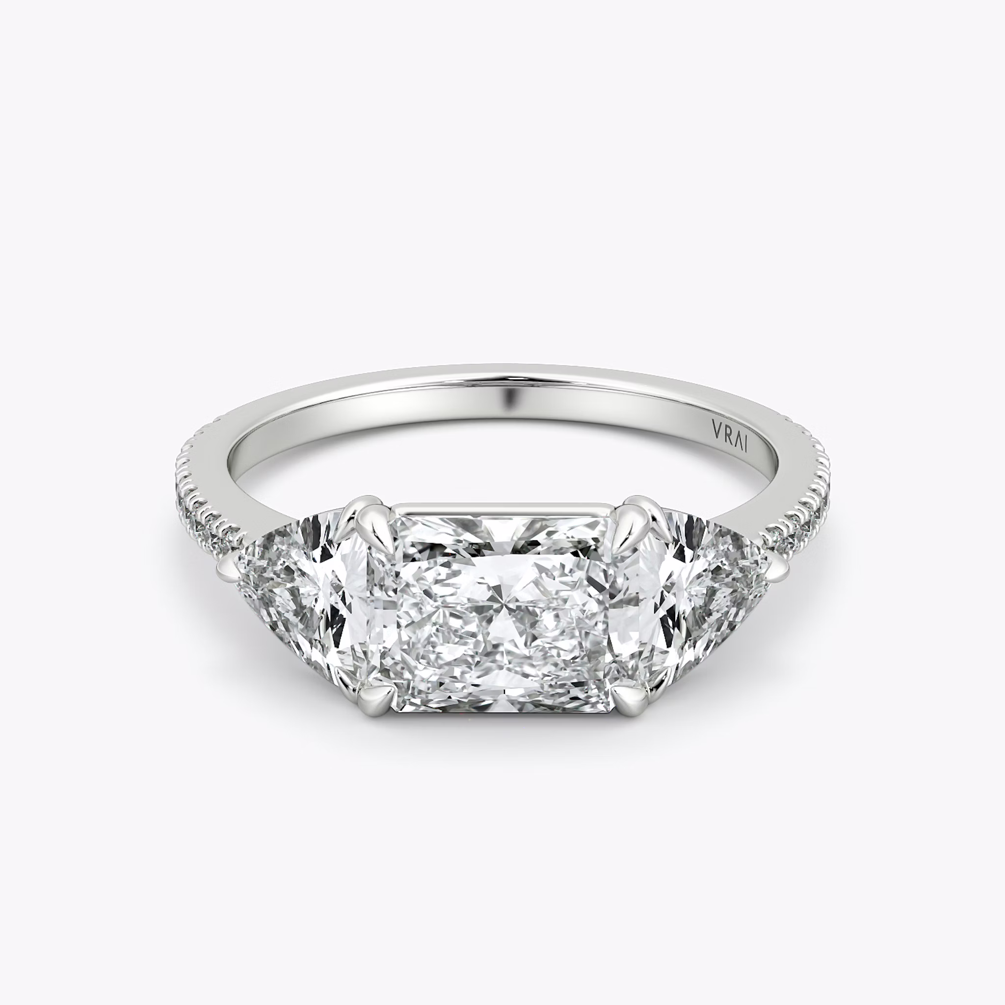 The Three Stone | Radiant | 18k | White Gold | bandAccent: Pavé | diamondOrientation: horizontal | sideStoneCarat: 0.50ct | sideStoneShape: Trillion | caratWeight: other