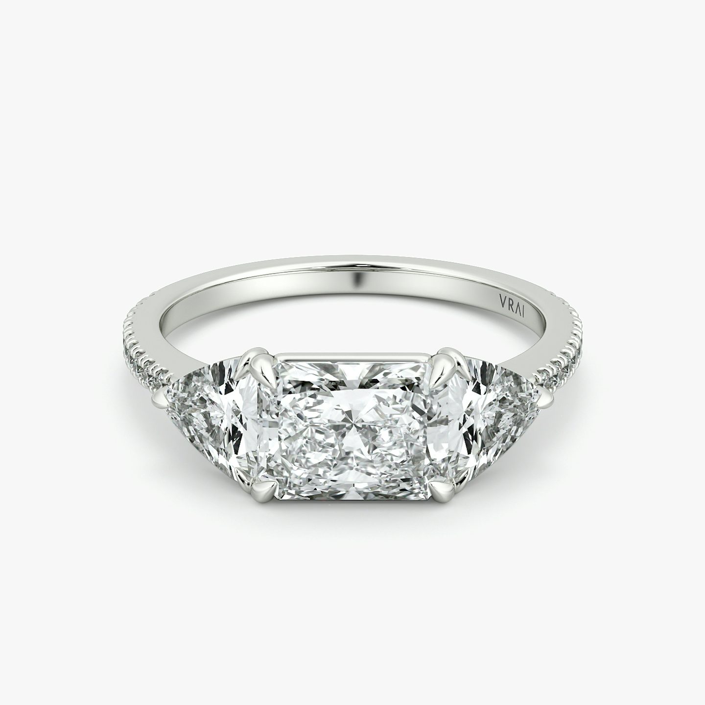 The Three Stone | Radiant | Platinum | bandAccent: Pavé | diamondOrientation: horizontal | sideStoneCarat: 0.50ct | sideStoneShape: Trillion | caratWeight: other