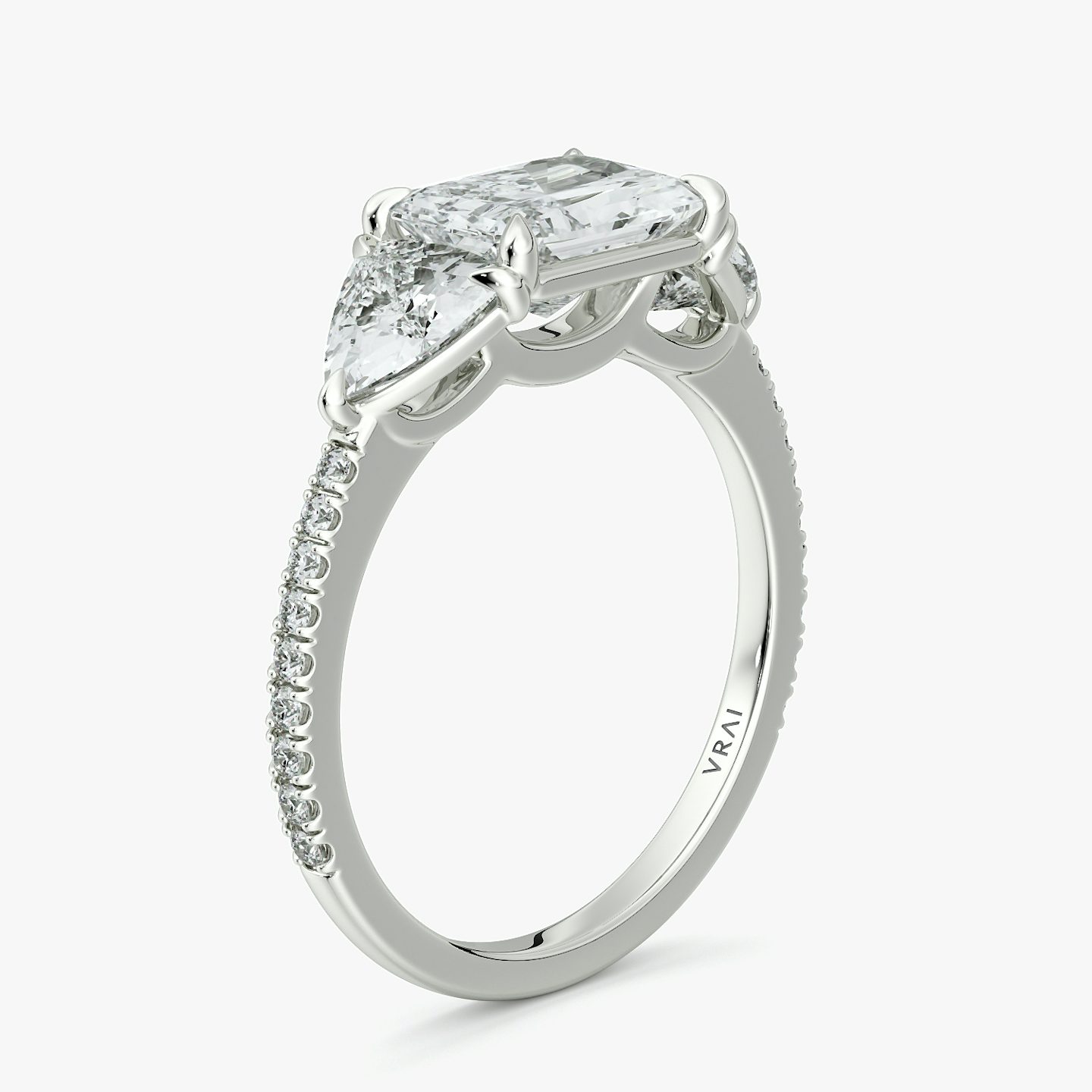 The Three Stone | Radiant | Platinum | bandAccent: Pavé | diamondOrientation: horizontal | sideStoneCarat: 0.50ct | sideStoneShape: Trillion | caratWeight: other