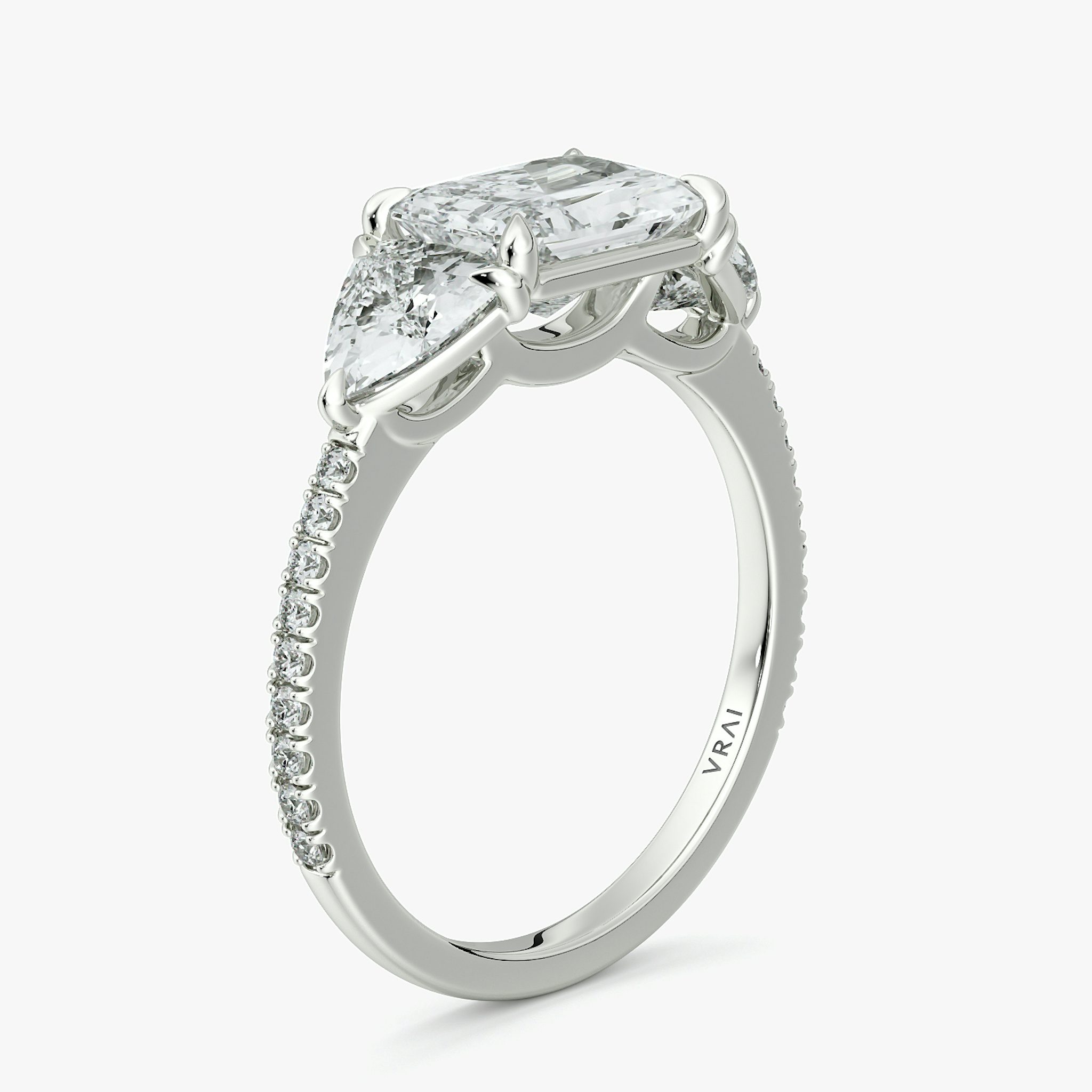 The Three Stone | Radiant | 18k | White Gold | bandAccent: Pavé | diamondOrientation: horizontal | sideStoneCarat: 0.50ct | sideStoneShape: Trillion | caratWeight: other