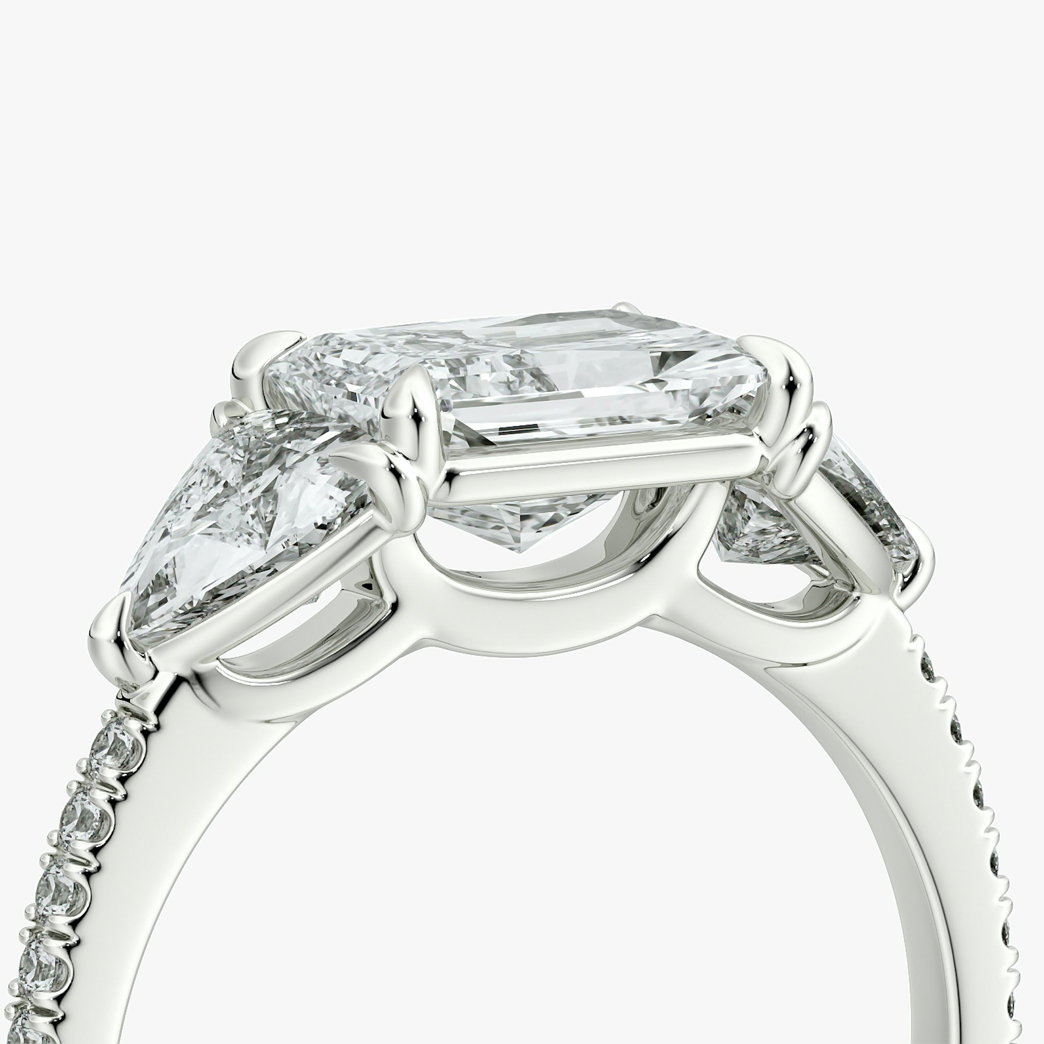 The Three Stone | Radiant | 18k | White Gold | bandAccent: Pavé | diamondOrientation: horizontal | sideStoneCarat: 0.50ct | sideStoneShape: Trillion | caratWeight: other