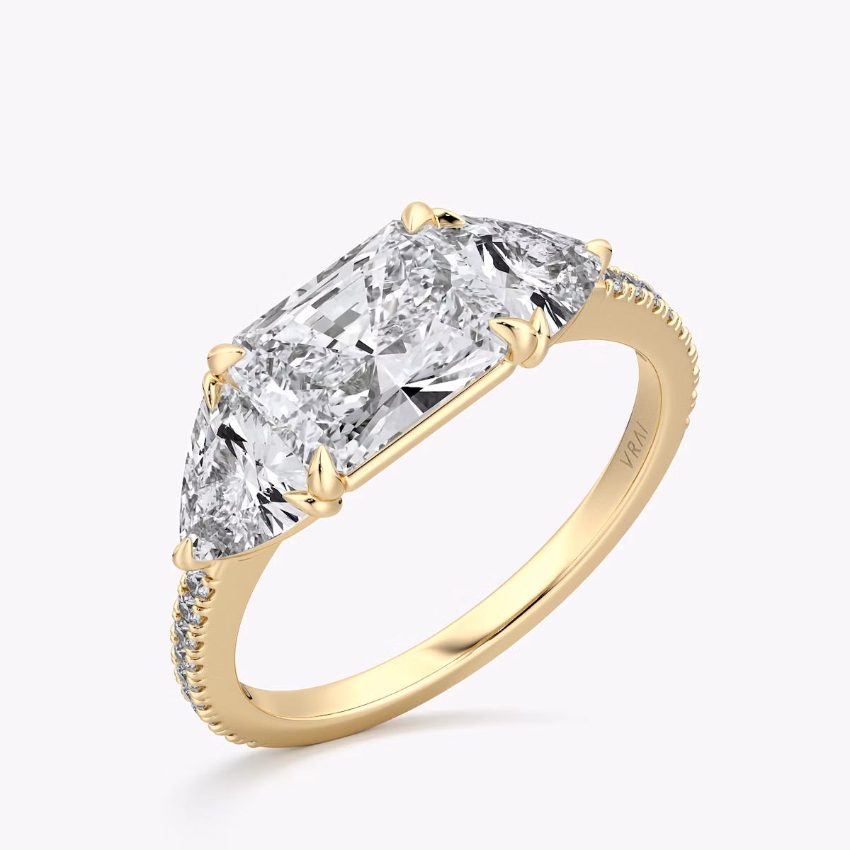 The Three Stone | Radiant | 18k | Yellow Gold | bandAccent: Pavé | diamondOrientation: horizontal | sideStoneCarat: 0.50ct | sideStoneShape: Trillion | caratWeight: other