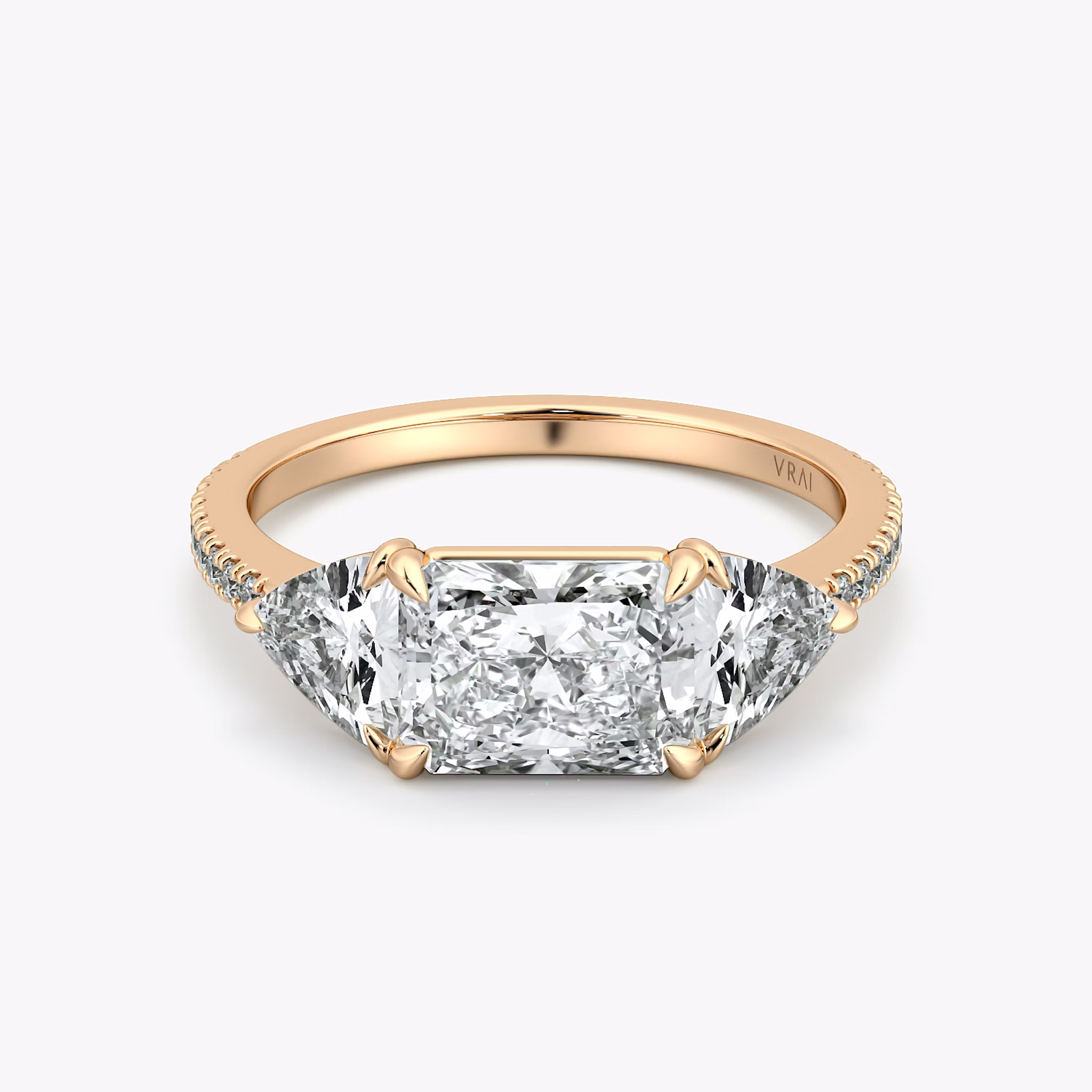 The Three Stone | Radiant | 14k | Rose Gold | bandAccent: Pavé | diamondOrientation: horizontal | sideStoneCarat: 0.50ct | sideStoneShape: Trillion | caratWeight: other