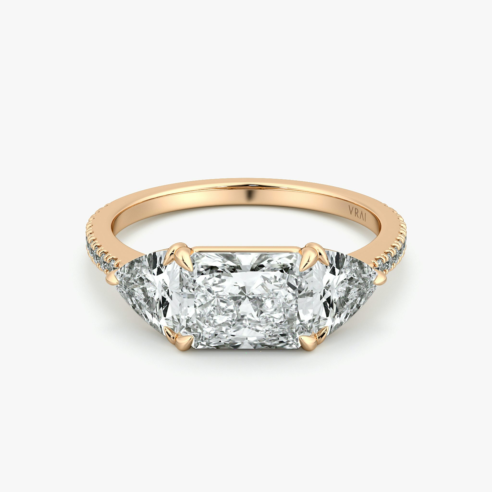 The Three Stone | Radiant | 14k | Rose Gold | bandAccent: Pavé | diamondOrientation: horizontal | sideStoneCarat: 0.50ct | sideStoneShape: Trillion | caratWeight: other