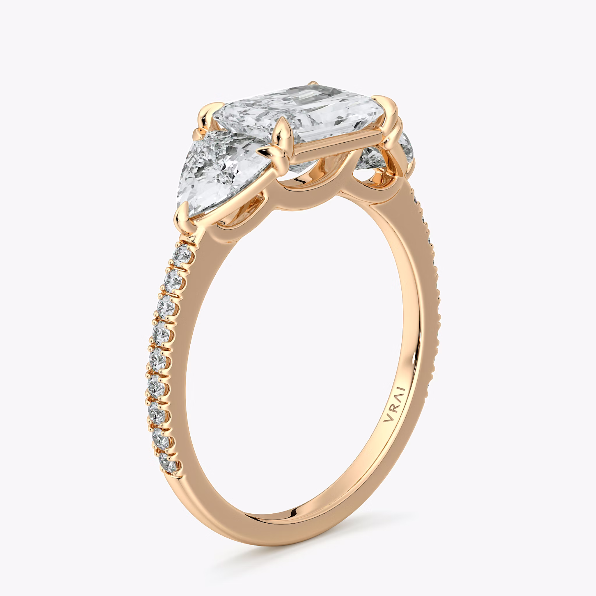 The Three Stone | Radiant | 14k | Rose Gold | bandAccent: Pavé | diamondOrientation: horizontal | sideStoneCarat: 0.50ct | sideStoneShape: Trillion | caratWeight: other