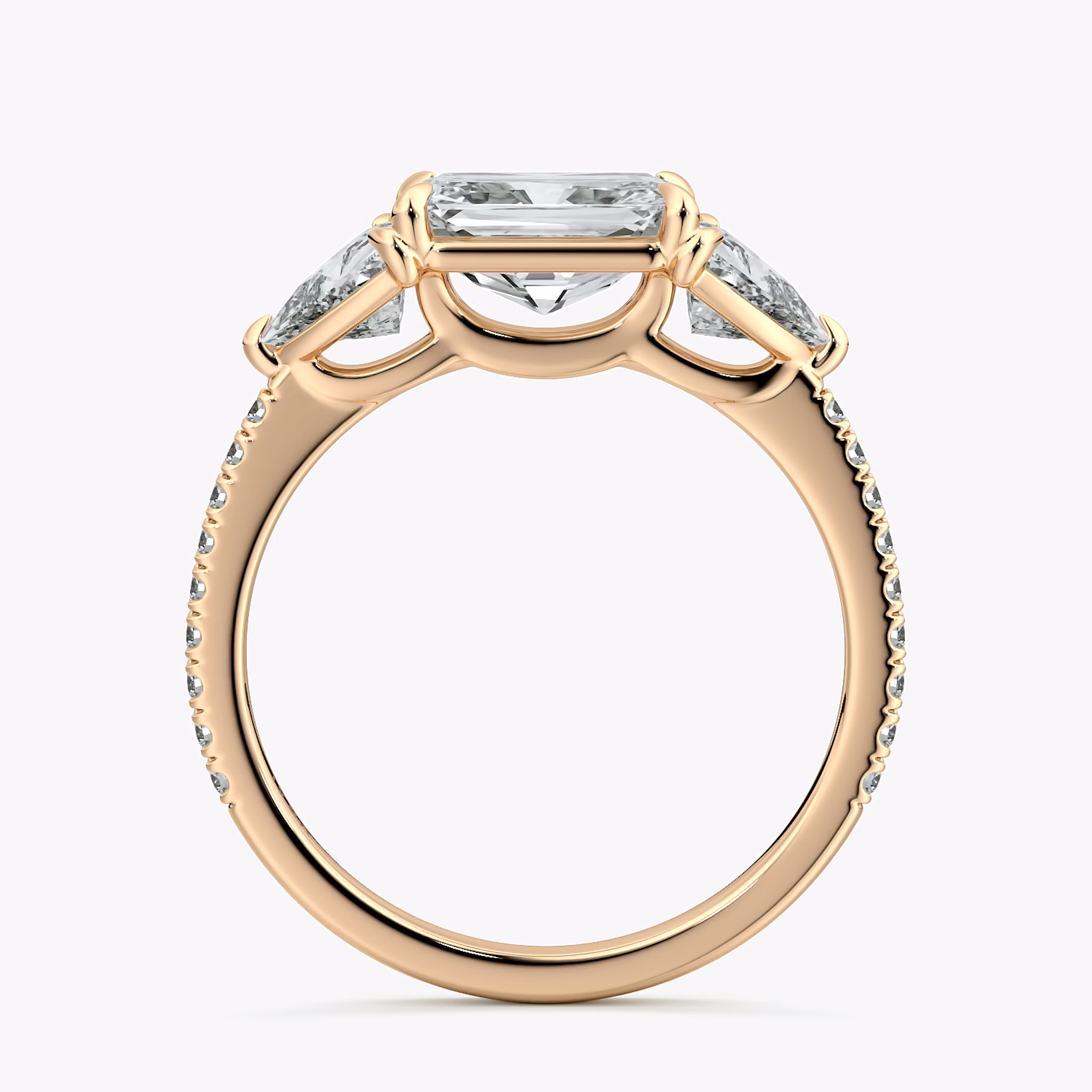 The Three Stone | Radiant | 14k | Rose Gold | bandAccent: Pavé | diamondOrientation: horizontal | sideStoneCarat: 0.50ct | sideStoneShape: Trillion | caratWeight: other