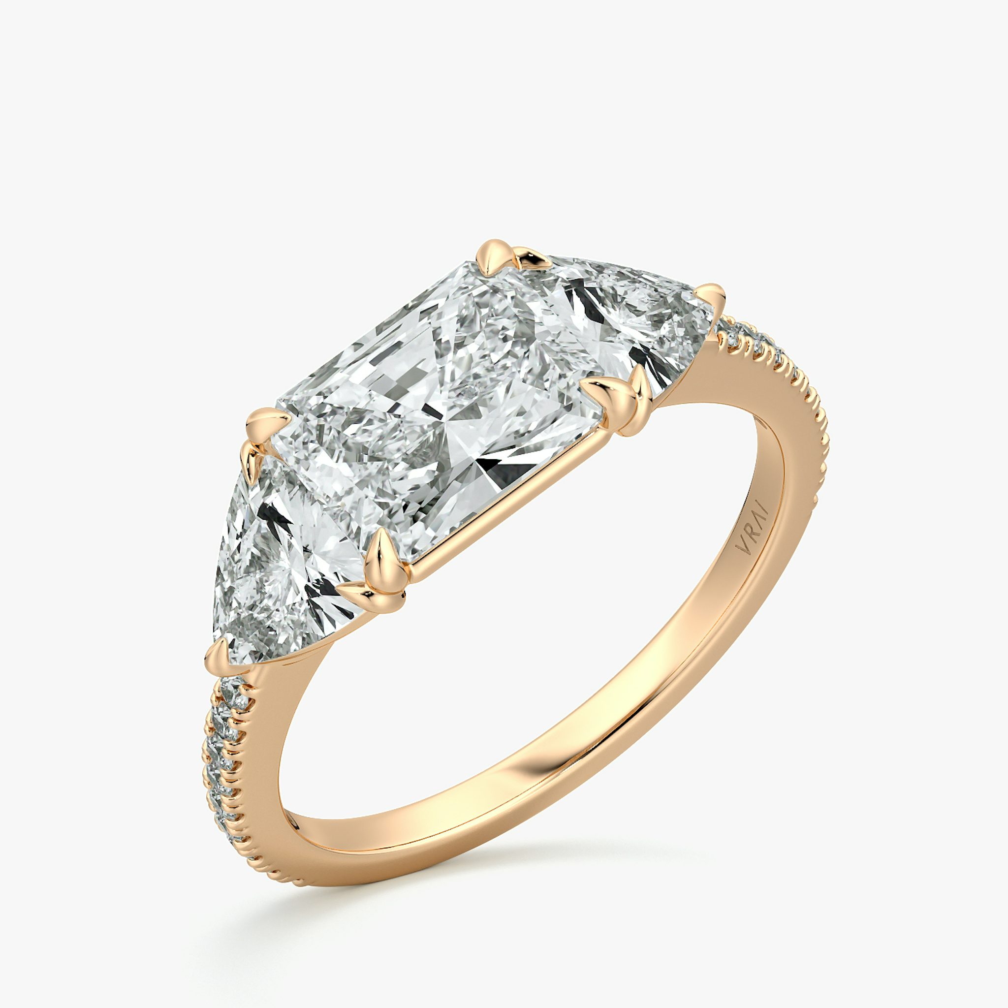 The Three Stone | Radiant | 14k | Rose Gold | bandAccent: Pavé | diamondOrientation: horizontal | sideStoneCarat: 0.50ct | sideStoneShape: Trillion | caratWeight: other
