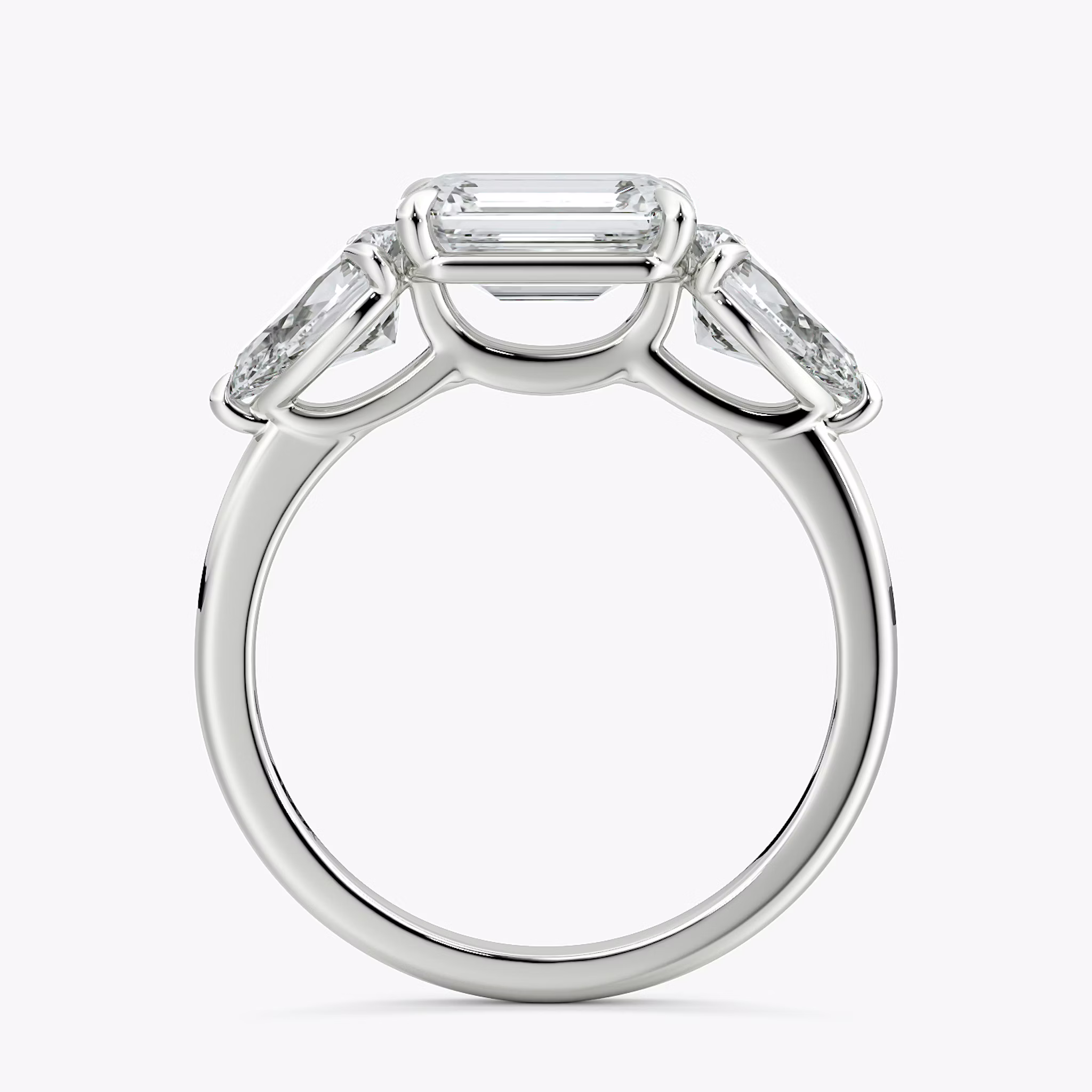 The Three Stone | Emerald | Platinum | bandAccent: Plain | diamondOrientation: horizontal | sideStoneCarat: 0.50ct | sideStoneShape: Pear | caratWeight: other