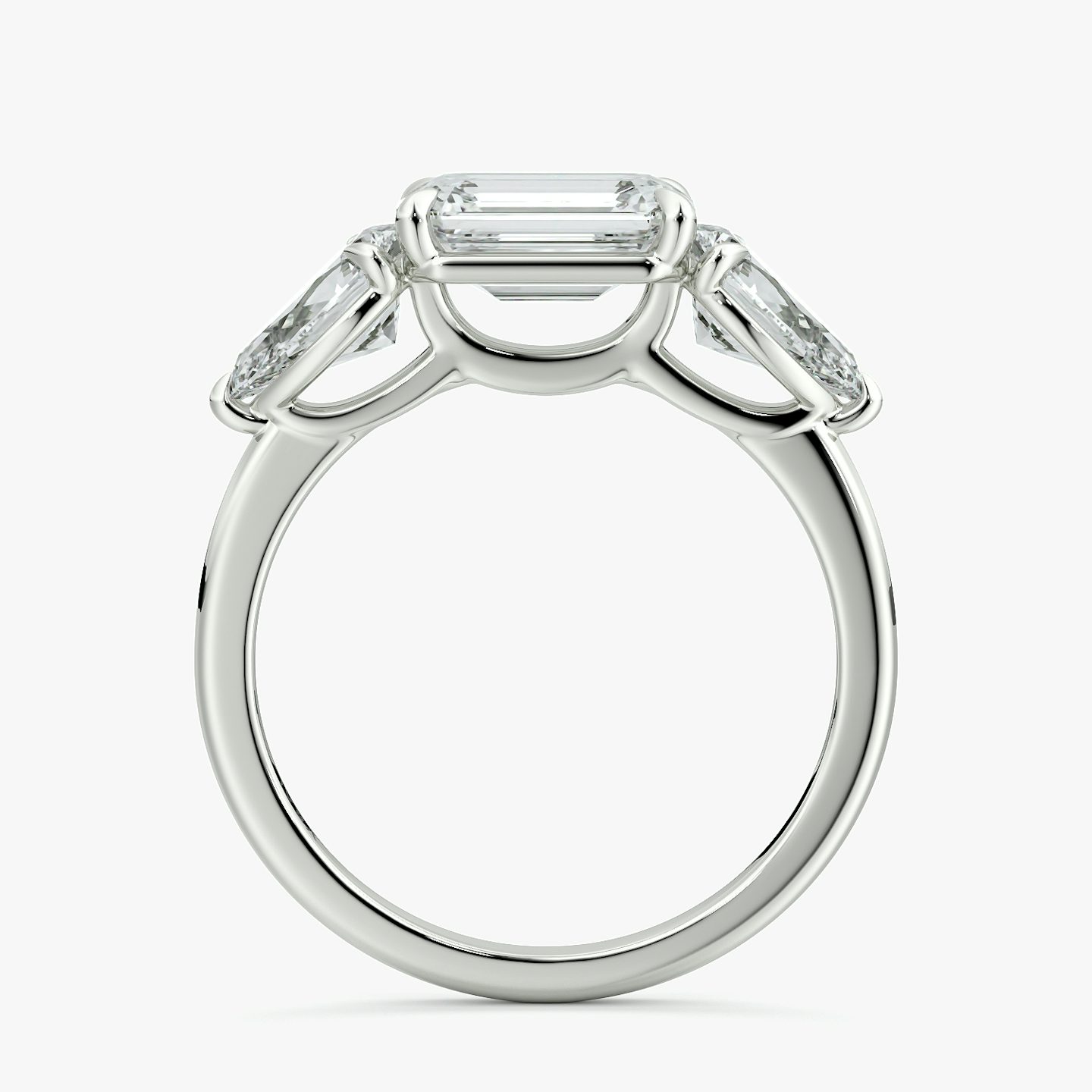 The Three Stone | Emerald | 18k | White Gold | bandAccent: Plain | diamondOrientation: horizontal | sideStoneCarat: 0.50ct | sideStoneShape: Pear | caratWeight: other