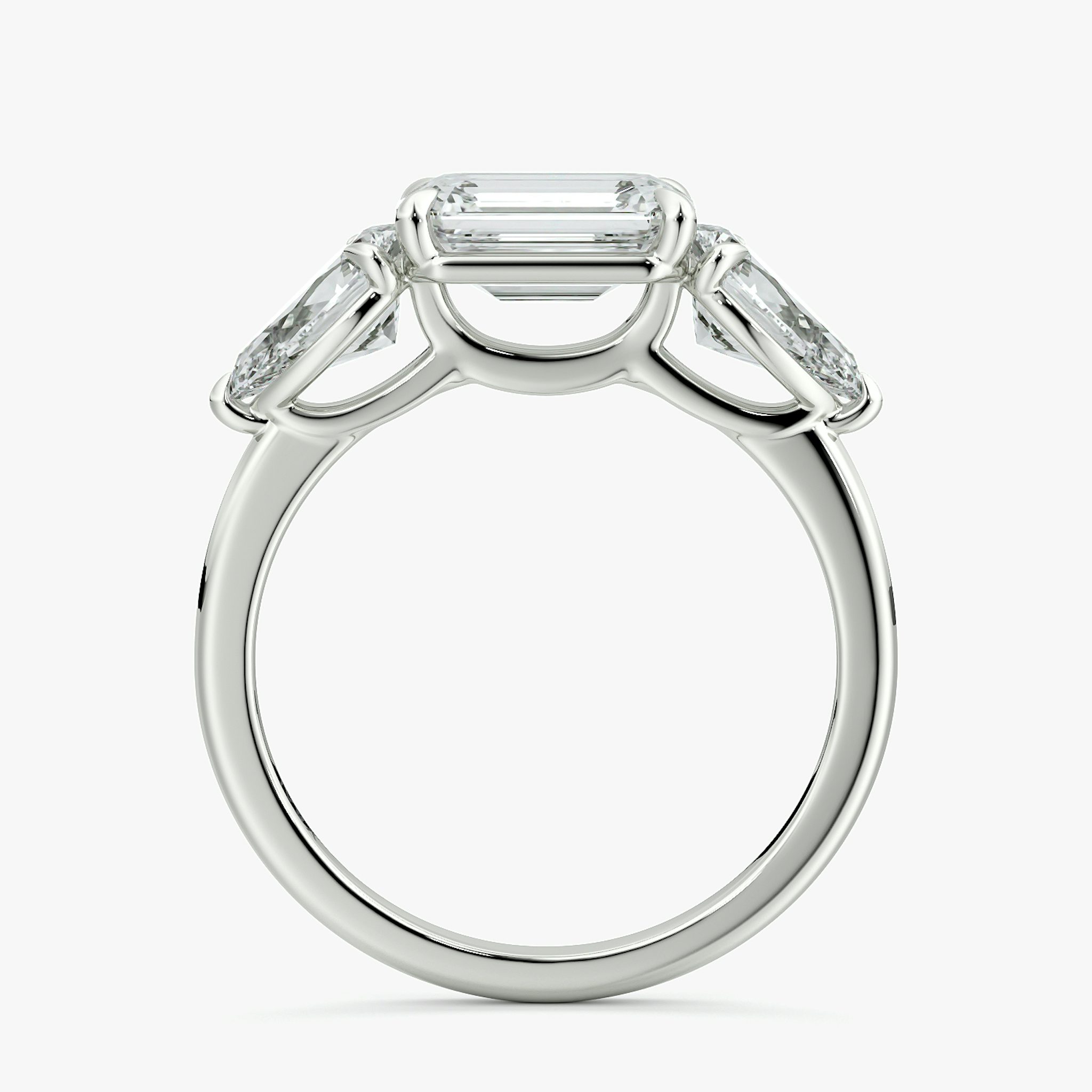 The Three Stone | Emerald | Platinum | bandAccent: Plain | diamondOrientation: horizontal | sideStoneCarat: 0.50ct | sideStoneShape: Pear | caratWeight: other