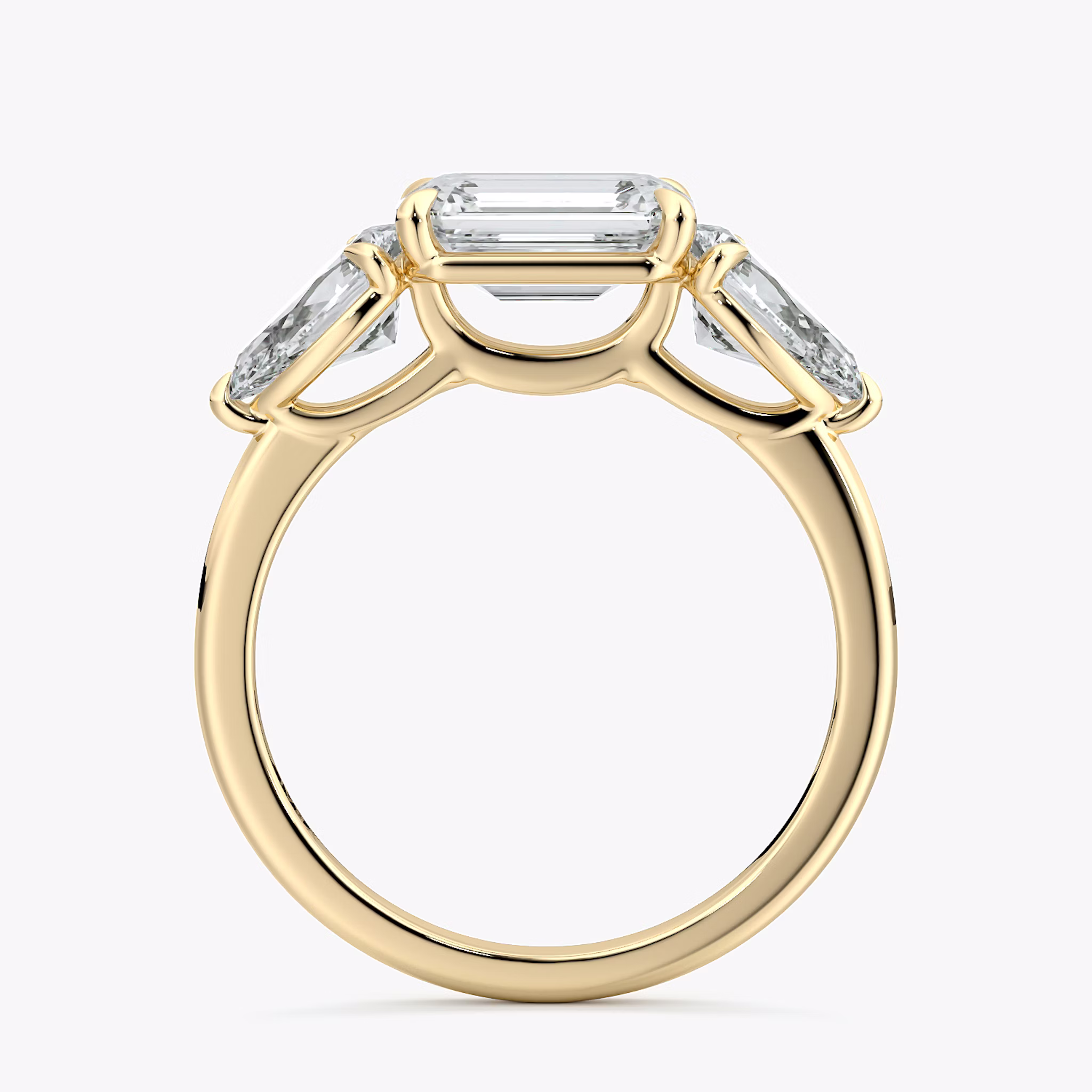 The Three Stone | Emerald | 18k | Yellow Gold | bandAccent: Plain | diamondOrientation: horizontal | sideStoneCarat: 0.50ct | sideStoneShape: Pear | caratWeight: other