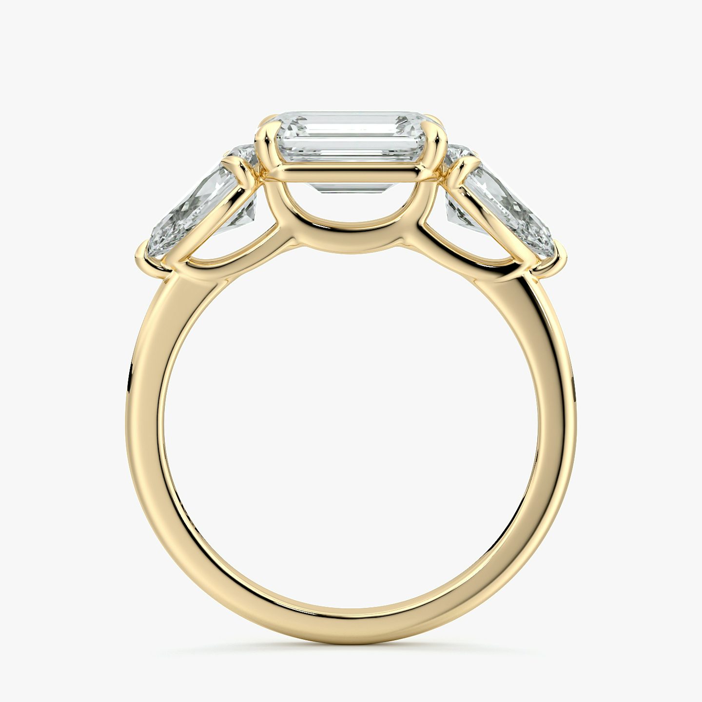 The Three Stone | Emerald | 18k | Yellow Gold | bandAccent: Plain | diamondOrientation: horizontal | sideStoneCarat: 0.50ct | sideStoneShape: Pear | caratWeight: other