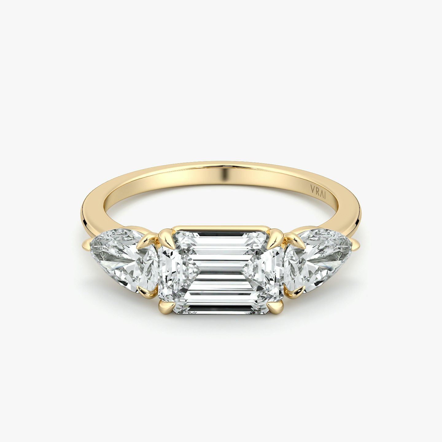 The Three Stone | Emerald | 18k | Yellow Gold | bandAccent: Plain | diamondOrientation: horizontal | sideStoneCarat: 0.50ct | sideStoneShape: Pear | caratWeight: other