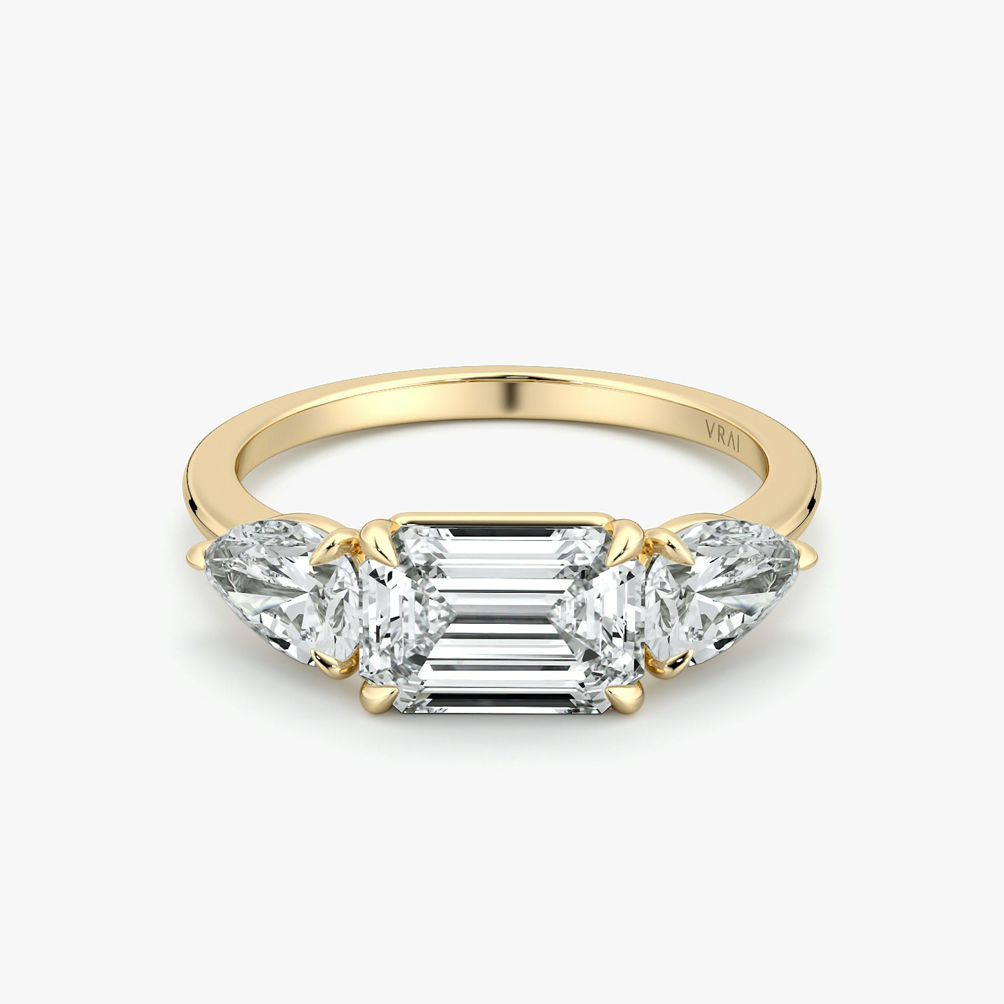 The Three Stone | Emerald | 18k | Yellow Gold | bandAccent: Plain | diamondOrientation: horizontal | sideStoneCarat: 0.50ct | sideStoneShape: Pear | caratWeight: other