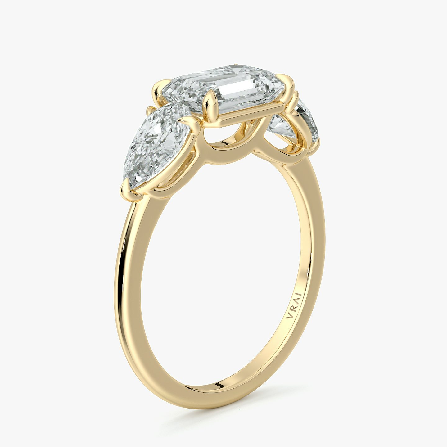 The Three Stone | Emerald | 18k | Yellow Gold | bandAccent: Plain | diamondOrientation: horizontal | sideStoneCarat: 0.50ct | sideStoneShape: Pear | caratWeight: other