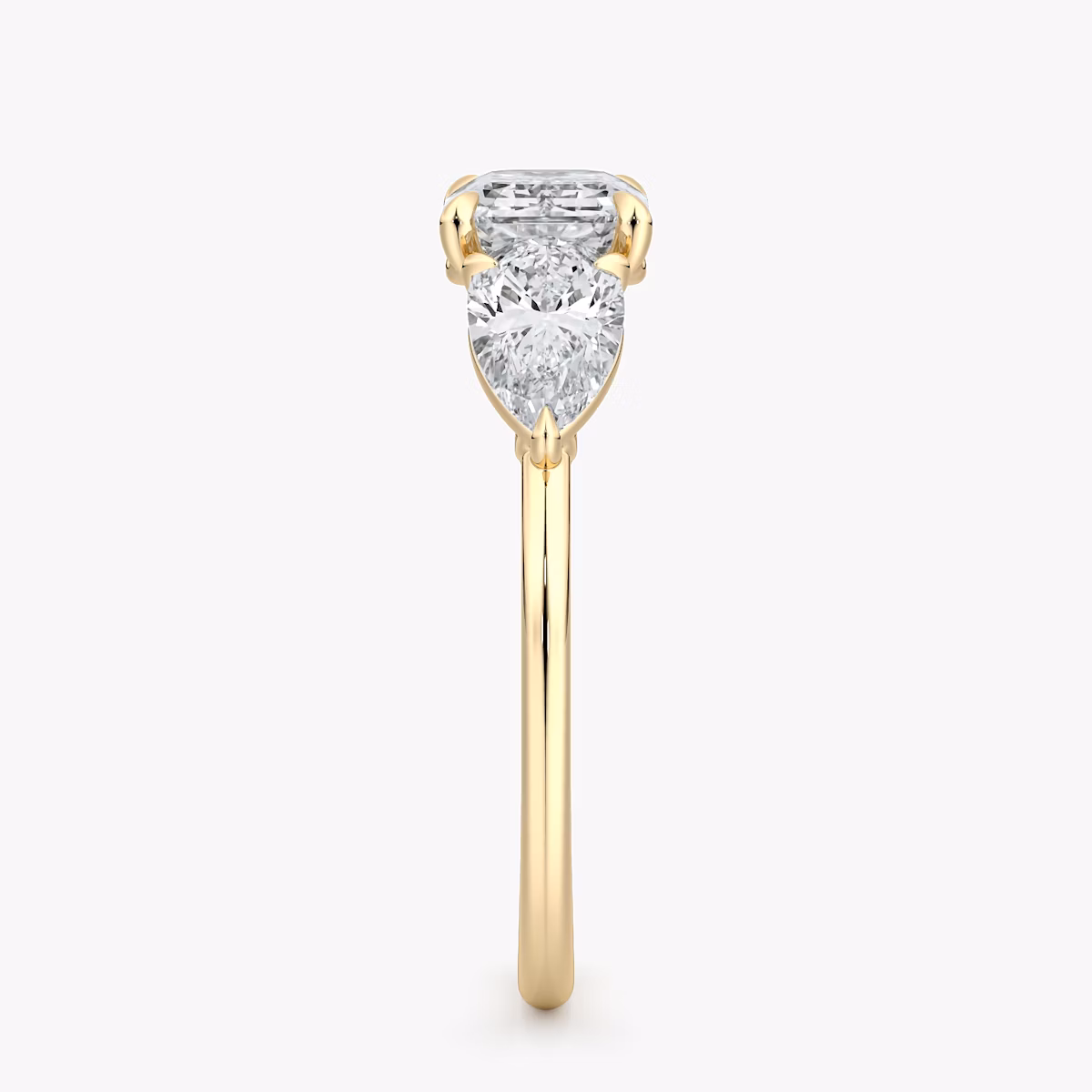 The Three Stone | Emerald | 18k | Yellow Gold | bandAccent: Plain | diamondOrientation: horizontal | sideStoneCarat: 0.50ct | sideStoneShape: Pear | caratWeight: other