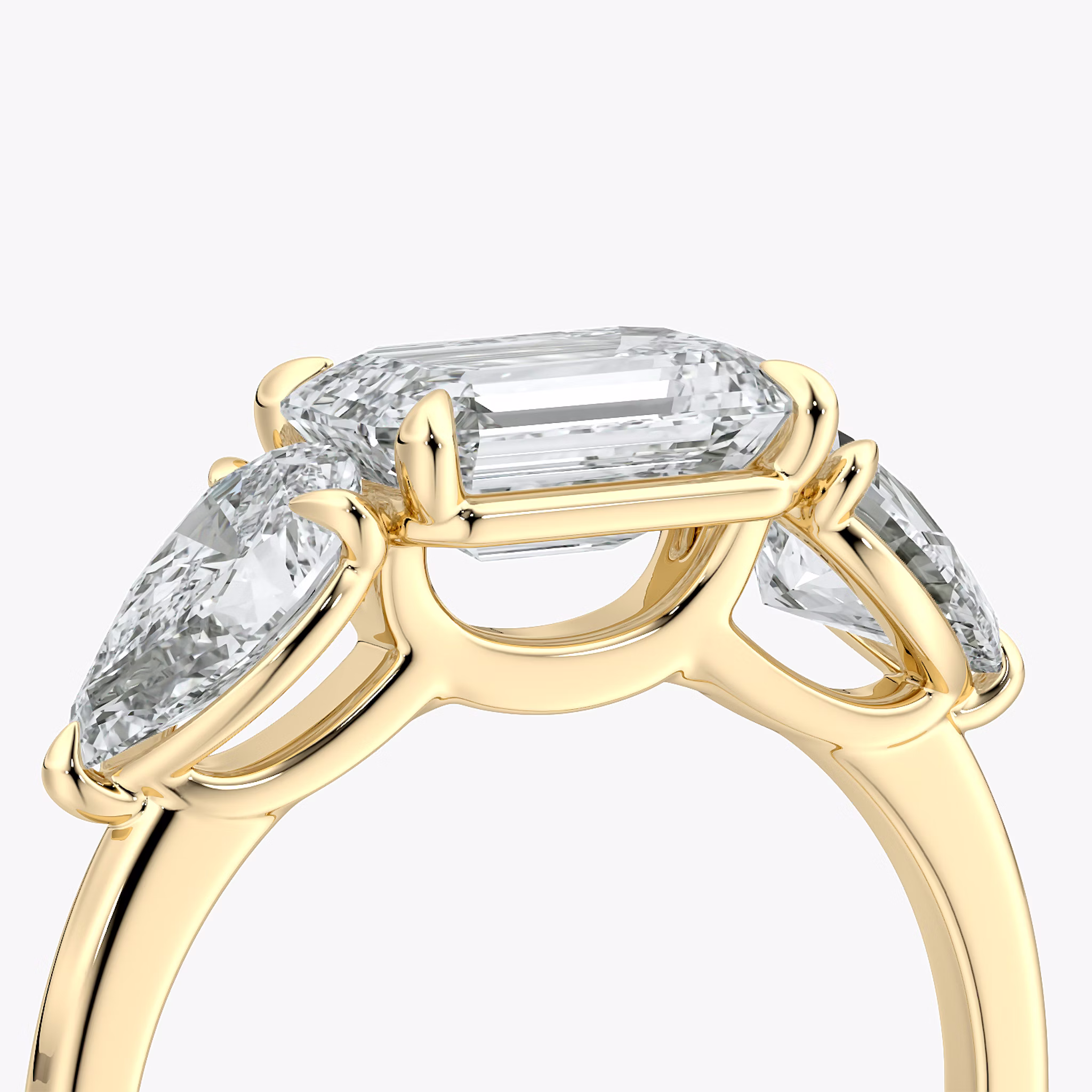 The Three Stone | Emerald | 18k | Yellow Gold | bandAccent: Plain | diamondOrientation: horizontal | sideStoneCarat: 0.50ct | sideStoneShape: Pear | caratWeight: other