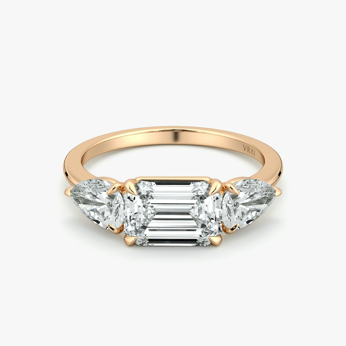 The Three Stone | Emerald | 14k | Rose Gold | bandAccent: Plain | diamondOrientation: horizontal | sideStoneCarat: 0.50ct | sideStoneShape: Pear | caratWeight: other
