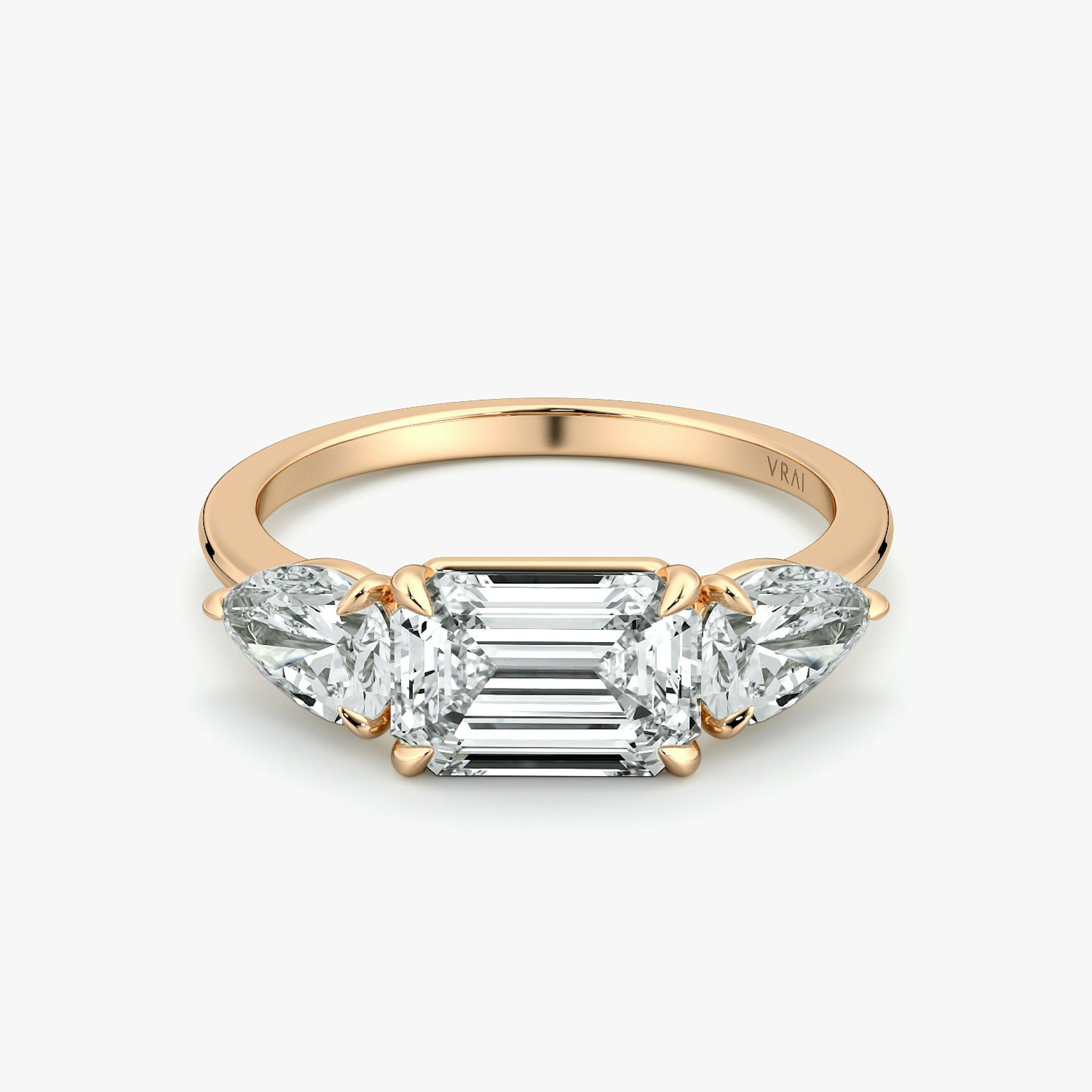 The Three Stone | Emerald | 14k | Rose Gold | bandAccent: Plain | diamondOrientation: horizontal | sideStoneCarat: 0.50ct | sideStoneShape: Pear | caratWeight: other