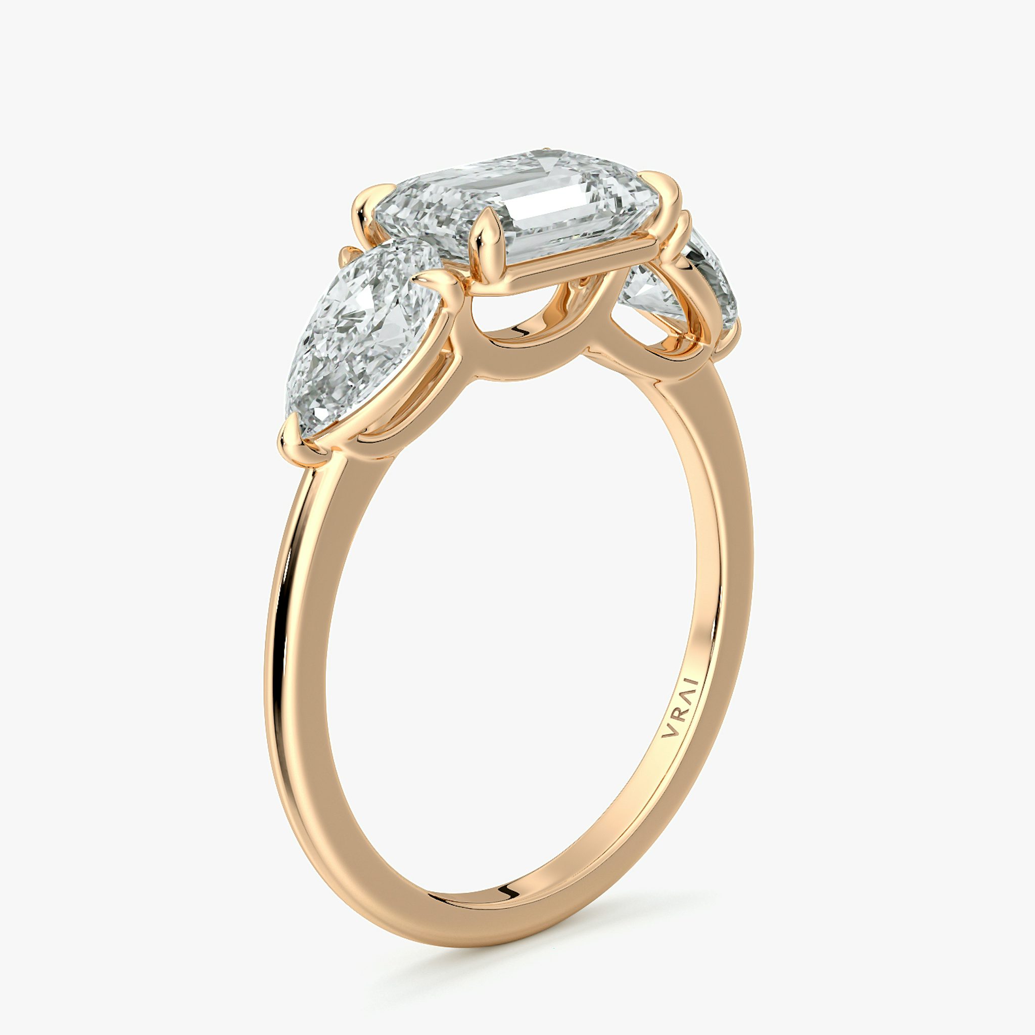 The Three Stone | Emerald | 14k | Rose Gold | bandAccent: Plain | diamondOrientation: horizontal | sideStoneCarat: 0.50ct | sideStoneShape: Pear | caratWeight: other