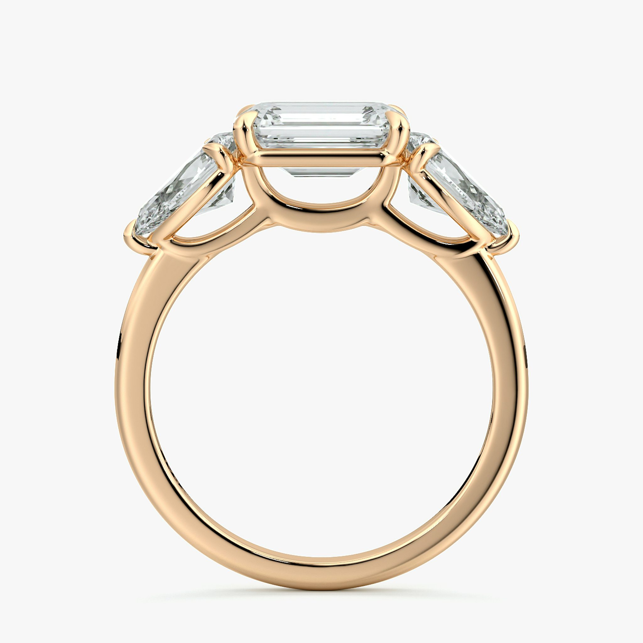 The Three Stone | Emerald | 14k | Rose Gold | bandAccent: Plain | diamondOrientation: horizontal | sideStoneCarat: 0.50ct | sideStoneShape: Pear | caratWeight: other