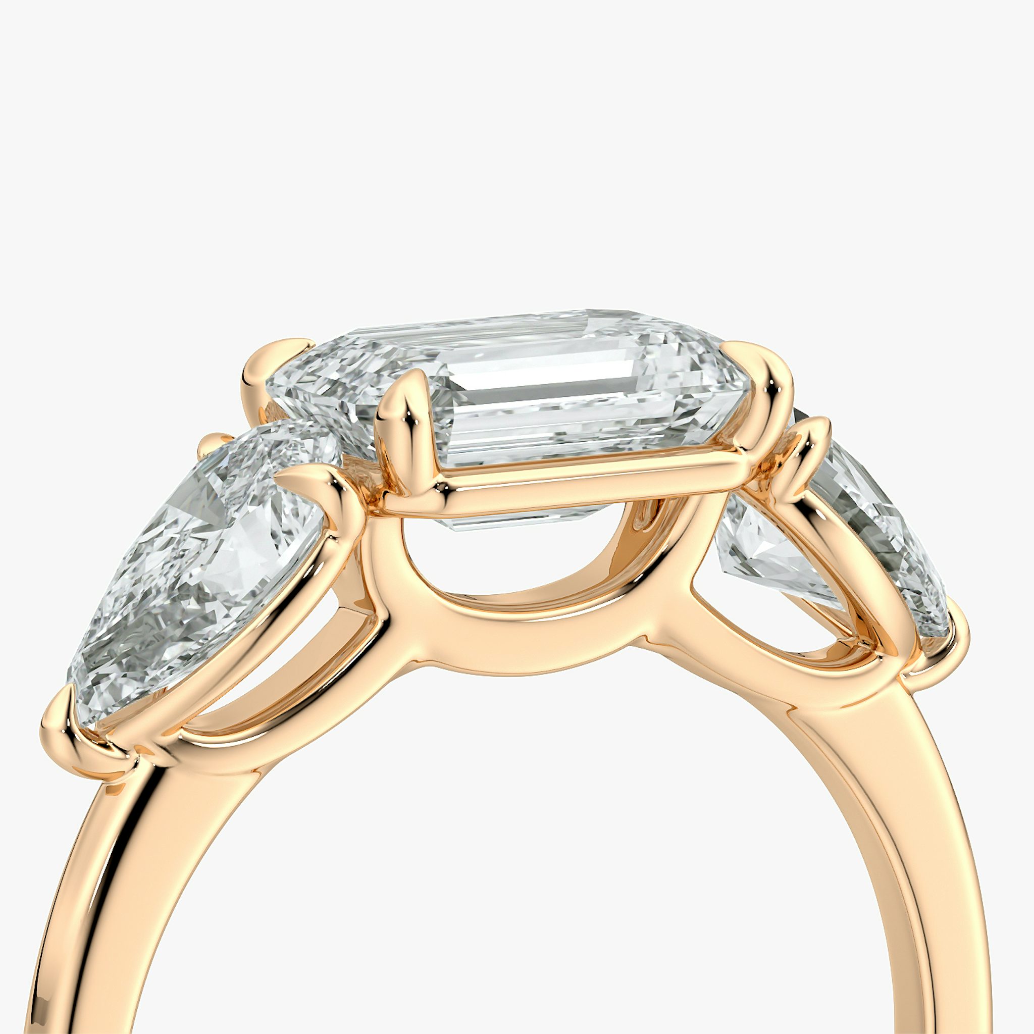 The Three Stone | Emerald | 14k | Rose Gold | bandAccent: Plain | diamondOrientation: horizontal | sideStoneCarat: 0.50ct | sideStoneShape: Pear | caratWeight: other