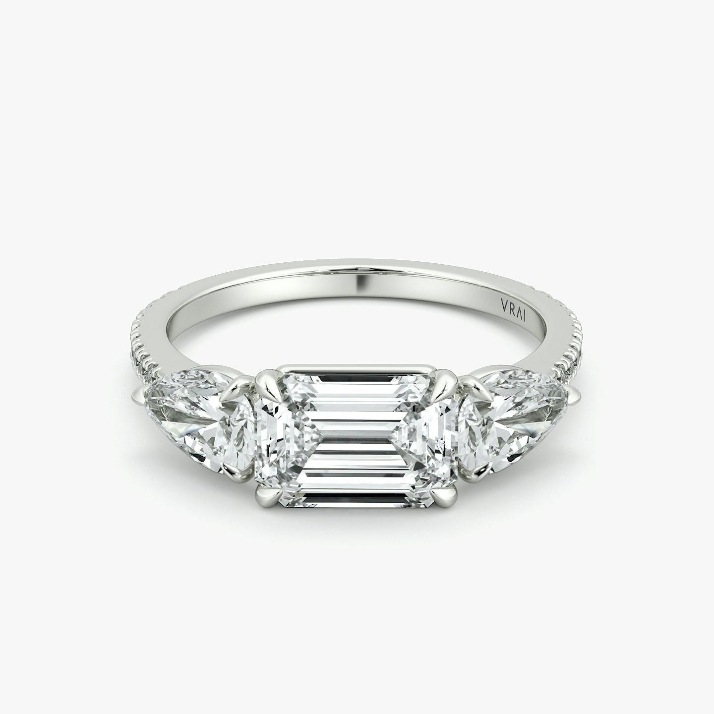 The Three Stone | Emerald | 18k | White Gold | bandAccent: Pavé | diamondOrientation: horizontal | sideStoneCarat: 0.50ct | sideStoneShape: Pear | caratWeight: other