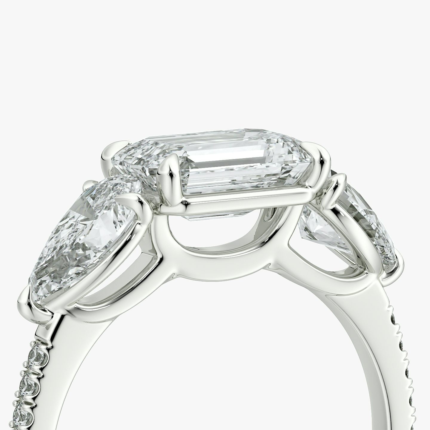 The Three Stone | Emerald | 18k | White Gold | bandAccent: Pavé | diamondOrientation: horizontal | sideStoneCarat: 0.50ct | sideStoneShape: Pear | caratWeight: other