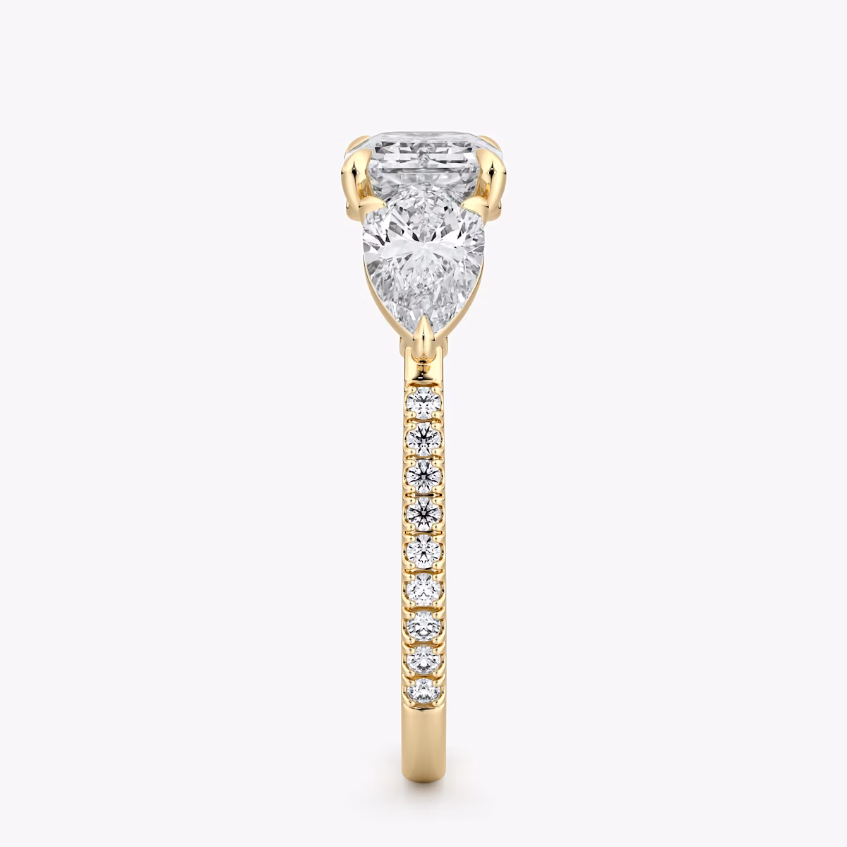 The Three Stone | Emerald | 18k | Yellow Gold | bandAccent: Pavé | diamondOrientation: horizontal | sideStoneCarat: 0.50ct | sideStoneShape: Pear | caratWeight: other