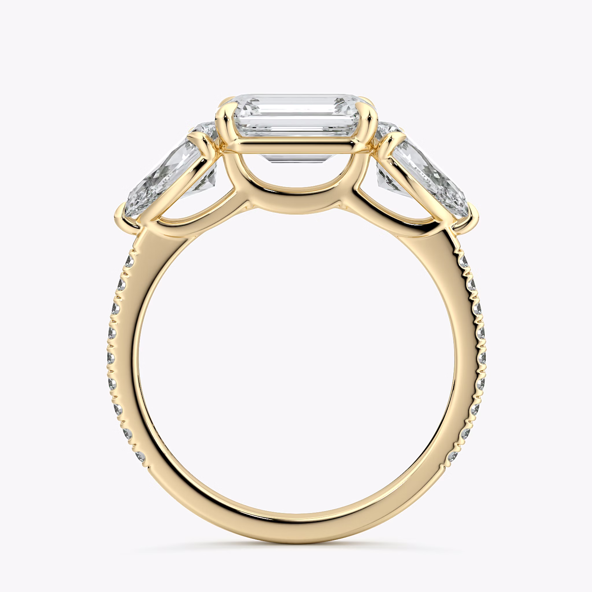 The Three Stone | Emerald | 18k | Yellow Gold | bandAccent: Pavé | diamondOrientation: horizontal | sideStoneCarat: 0.50ct | sideStoneShape: Pear | caratWeight: other