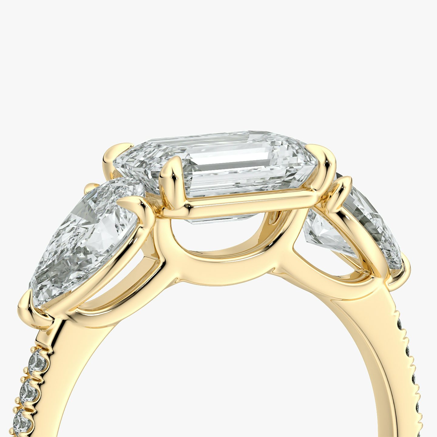 The Three Stone | Emerald | 18k | Yellow Gold | bandAccent: Pavé | diamondOrientation: horizontal | sideStoneCarat: 0.50ct | sideStoneShape: Pear | caratWeight: other