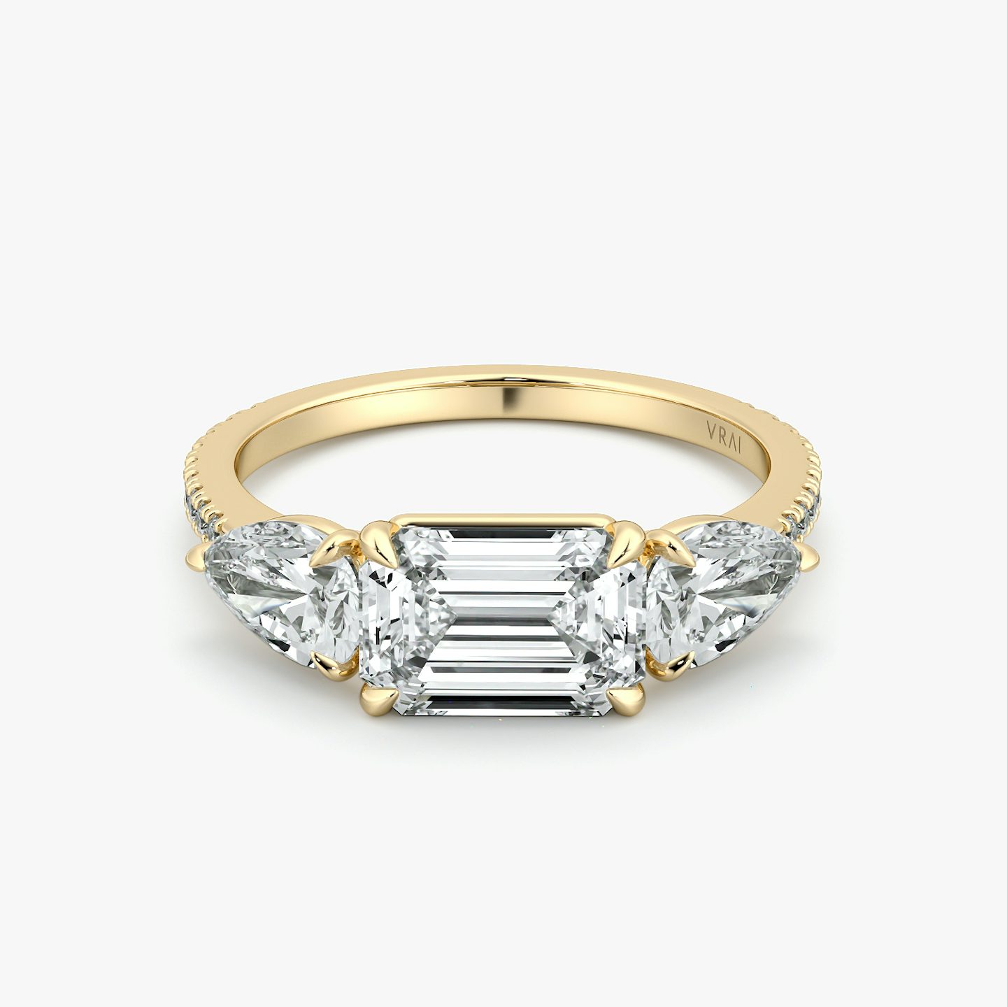 The Three Stone | Emerald | 18k | Yellow Gold | bandAccent: Pavé | diamondOrientation: horizontal | sideStoneCarat: 0.50ct | sideStoneShape: Pear | caratWeight: other