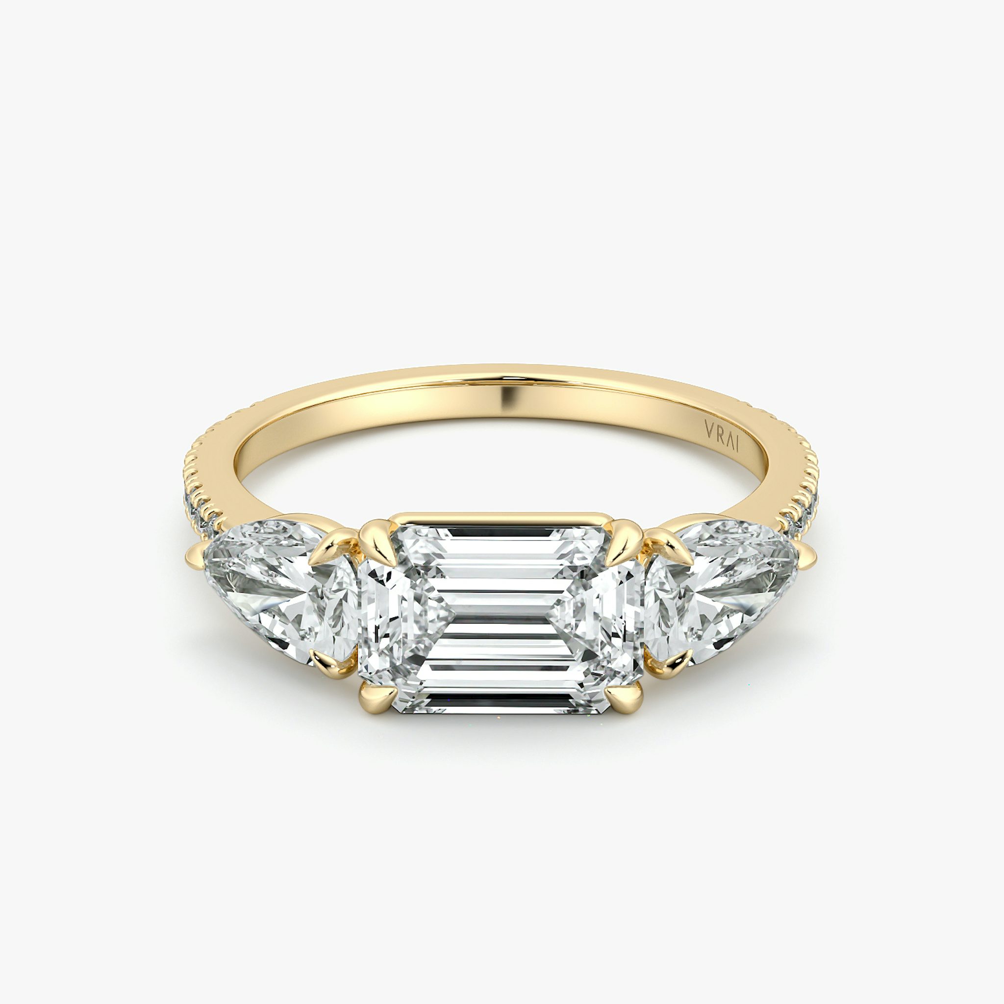 The Three Stone | Emerald | 18k | Yellow Gold | bandAccent: Pavé | diamondOrientation: horizontal | sideStoneCarat: 0.50ct | sideStoneShape: Pear | caratWeight: other