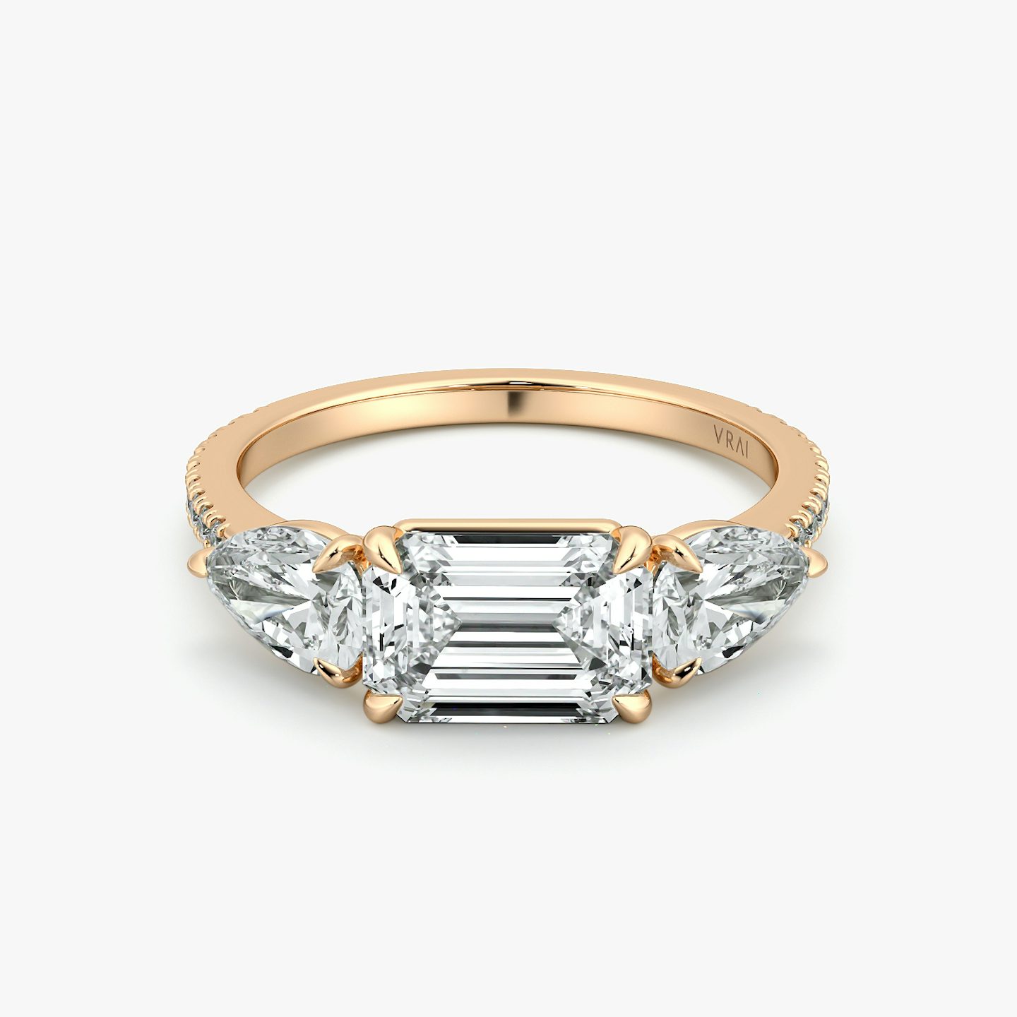 The Three Stone | Emerald | 14k | Rose Gold | bandAccent: Pavé | diamondOrientation: horizontal | sideStoneCarat: 0.50ct | sideStoneShape: Pear | caratWeight: other