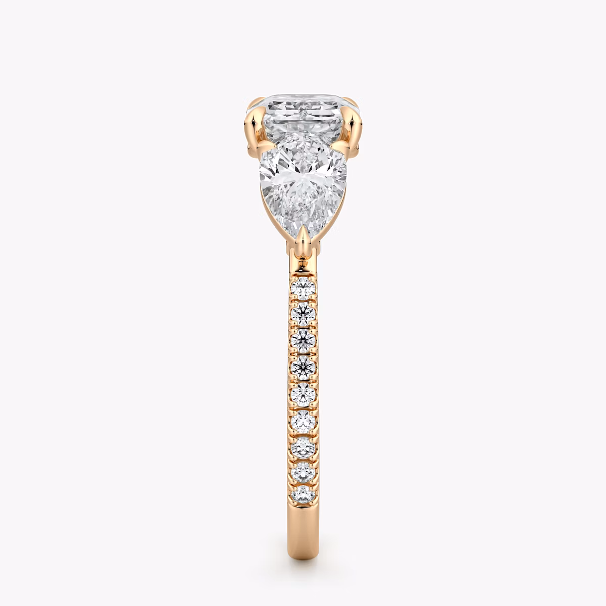 The Three Stone | Emerald | 14k | Rose Gold | bandAccent: Pavé | diamondOrientation: horizontal | sideStoneCarat: 0.50ct | sideStoneShape: Pear | caratWeight: other