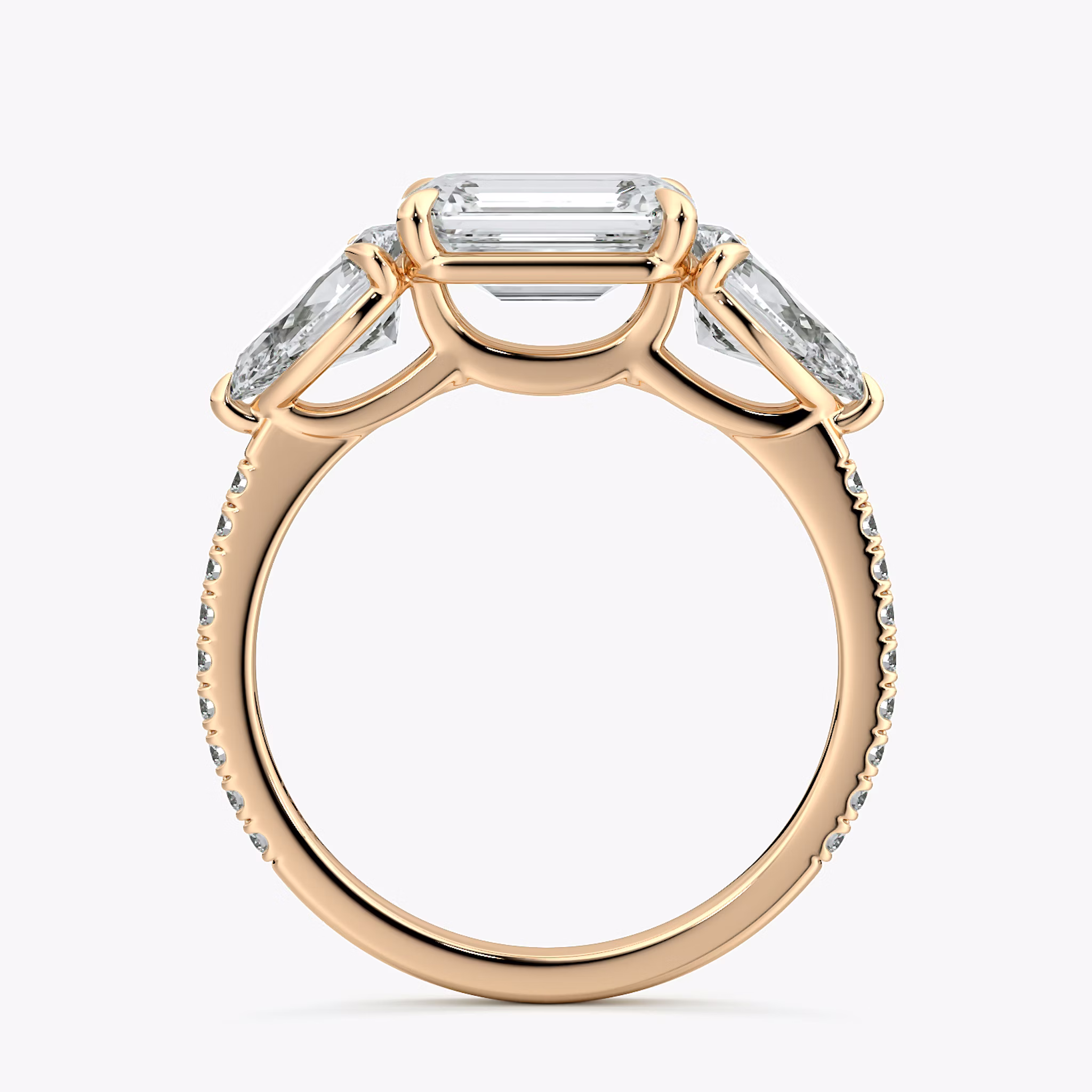 The Three Stone | Emerald | 14k | Rose Gold | bandAccent: Pavé | diamondOrientation: horizontal | sideStoneCarat: 0.50ct | sideStoneShape: Pear | caratWeight: other