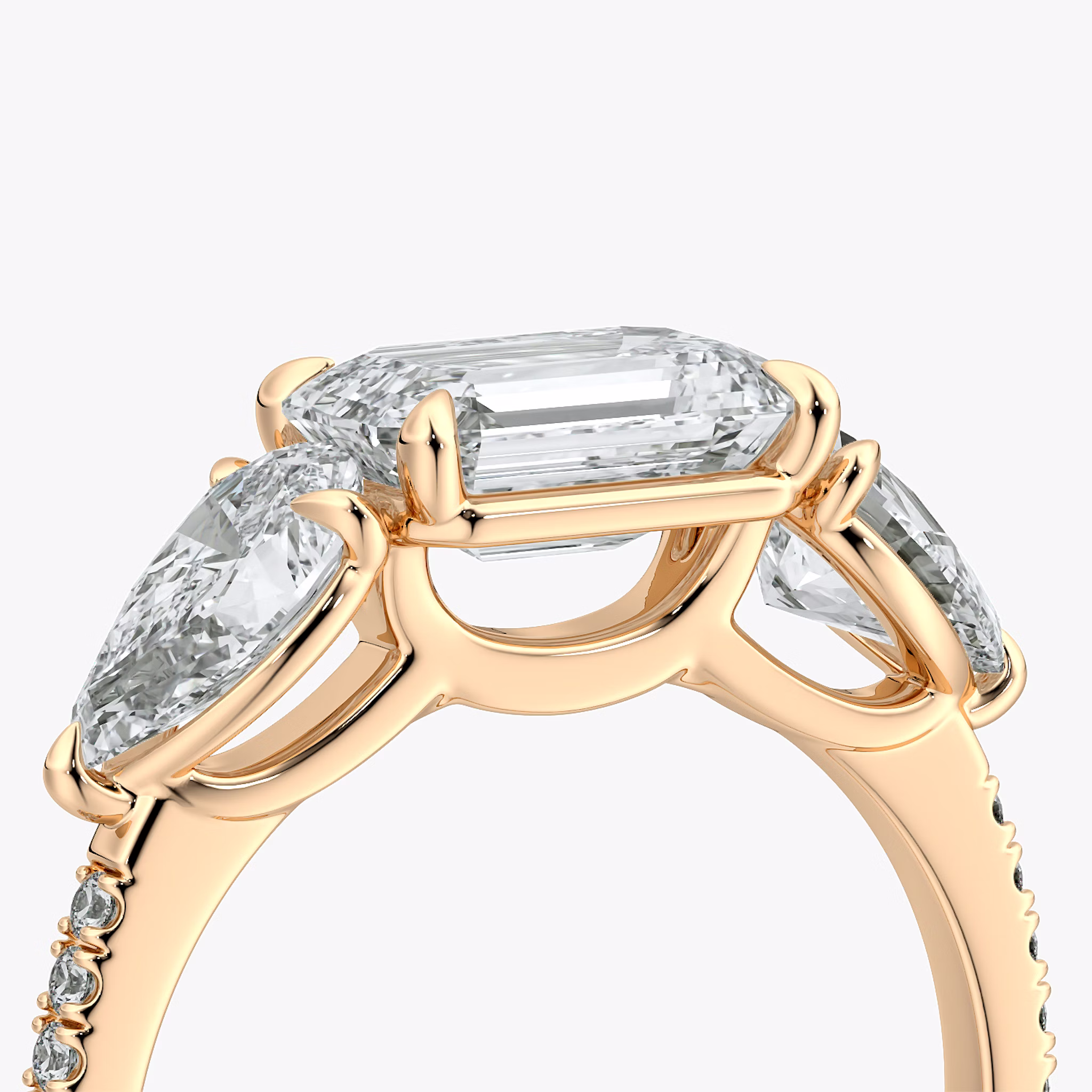 The Three Stone | Emerald | 14k | Rose Gold | bandAccent: Pavé | diamondOrientation: horizontal | sideStoneCarat: 0.50ct | sideStoneShape: Pear | caratWeight: other