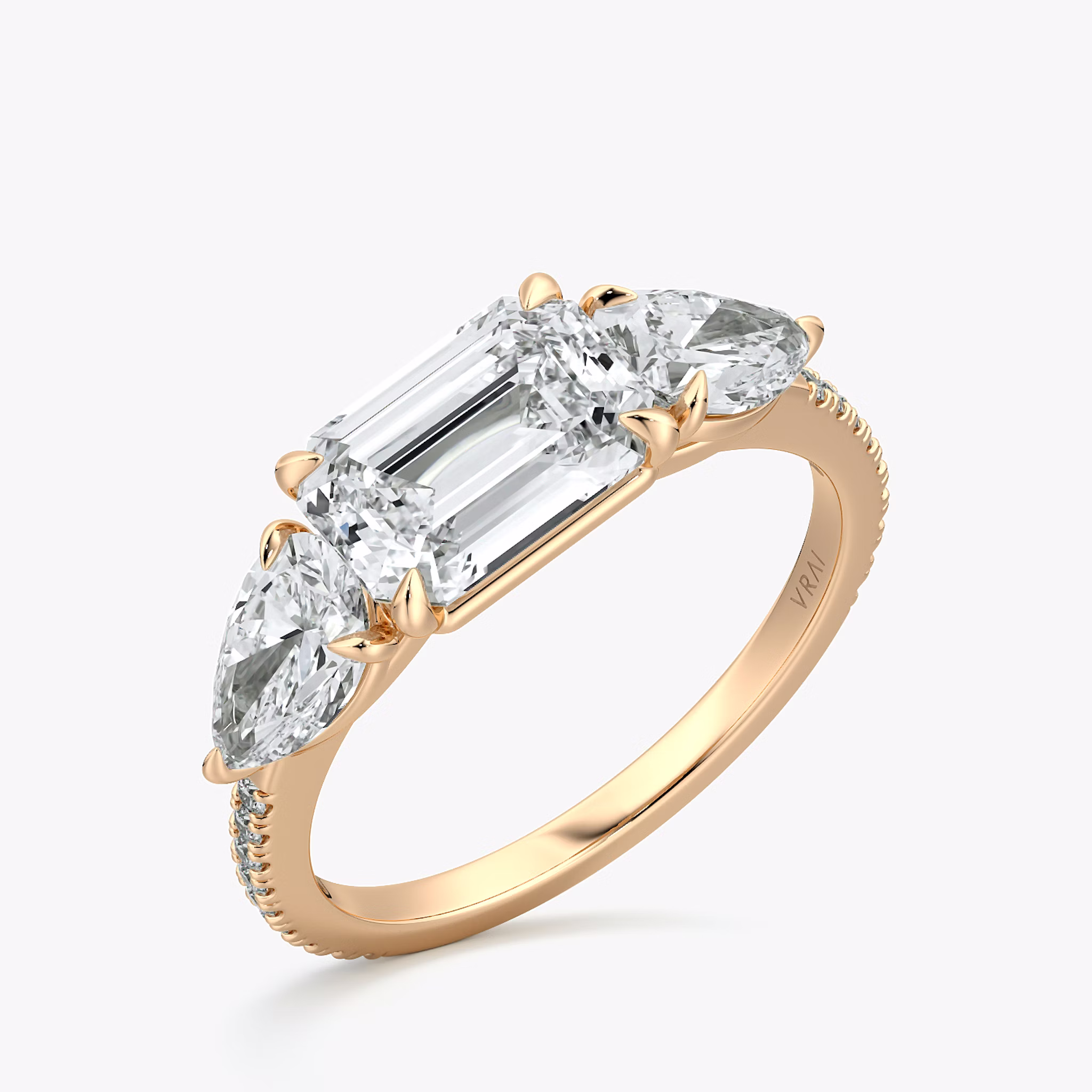 The Three Stone | Emerald | 14k | Rose Gold | bandAccent: Pavé | diamondOrientation: horizontal | sideStoneCarat: 0.50ct | sideStoneShape: Pear | caratWeight: other