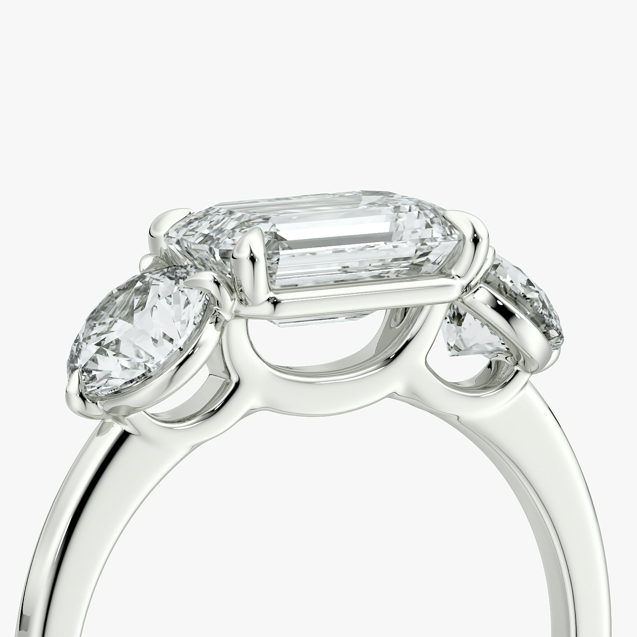 The Three Stone | Emerald | 18k | White Gold | bandAccent: Plain | diamondOrientation: horizontal | sideStoneCarat: 0.50ct | sideStoneShape: Round Brilliant | caratWeight: other