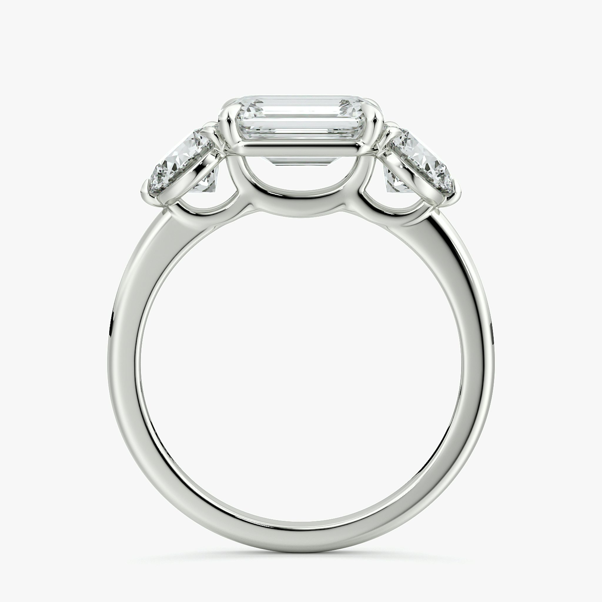 The Three Stone | Emerald | 18k | White Gold | bandAccent: Plain | diamondOrientation: horizontal | sideStoneCarat: 0.50ct | sideStoneShape: Round Brilliant | caratWeight: other